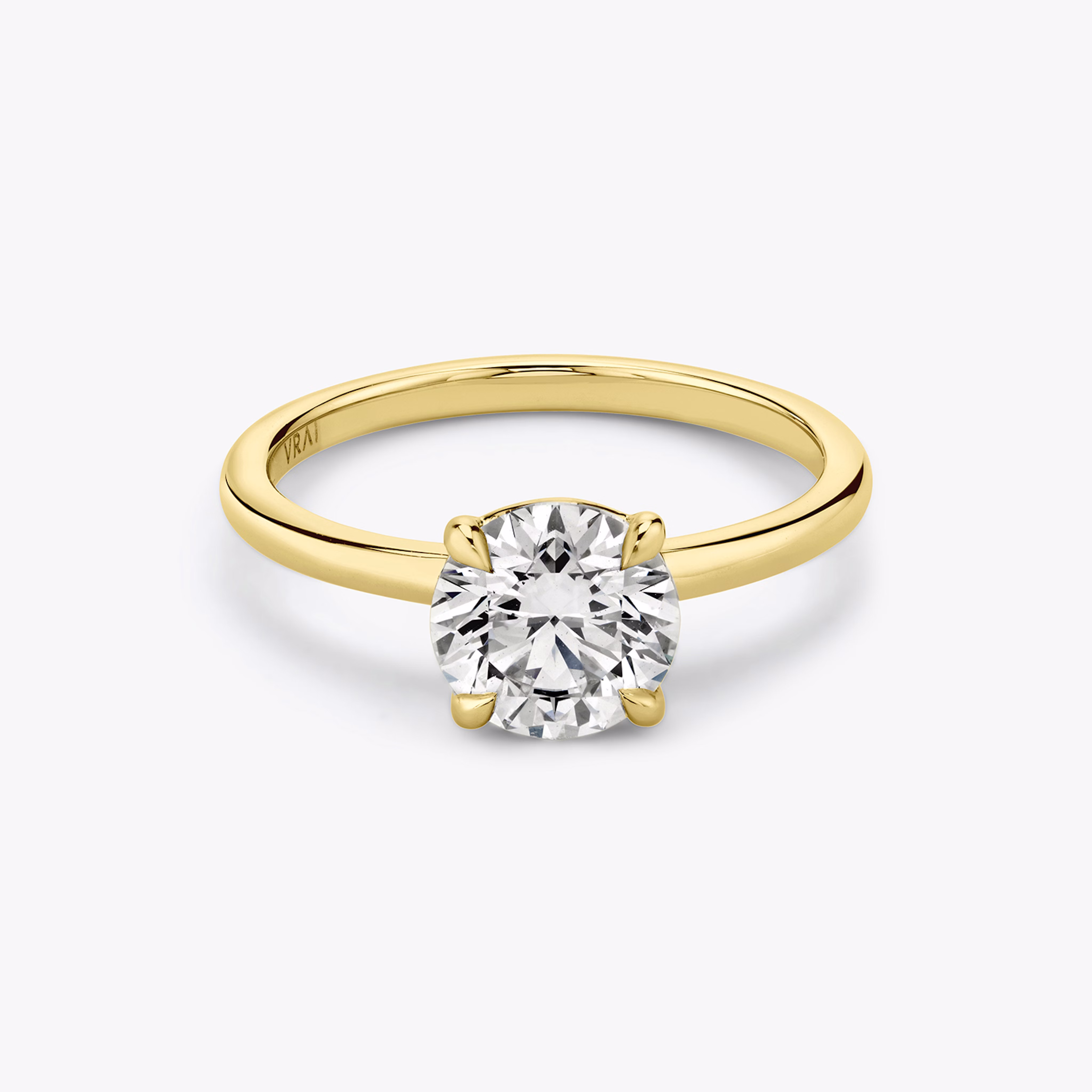 Yellow gold signature solitaire engagement ring with Round Brilliant cut diamond
