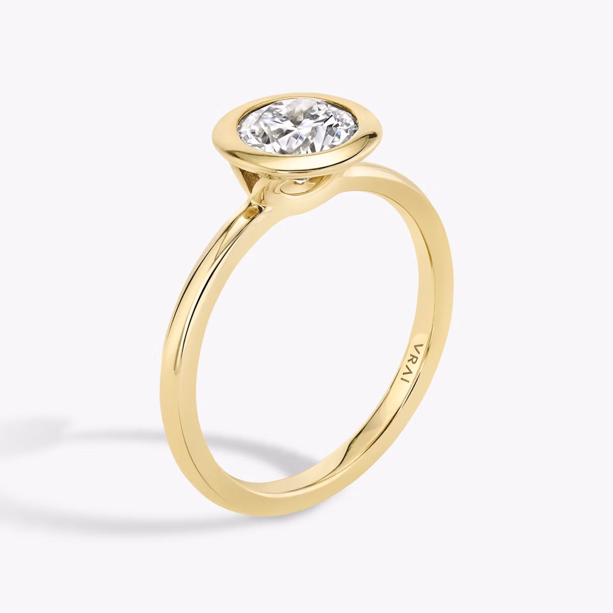 The Signature Bezel | Round Brilliant | 18k | Yellow Gold | bandAccent: Plain | caratWeight: 1.5ct | diamondOrientation: vertical