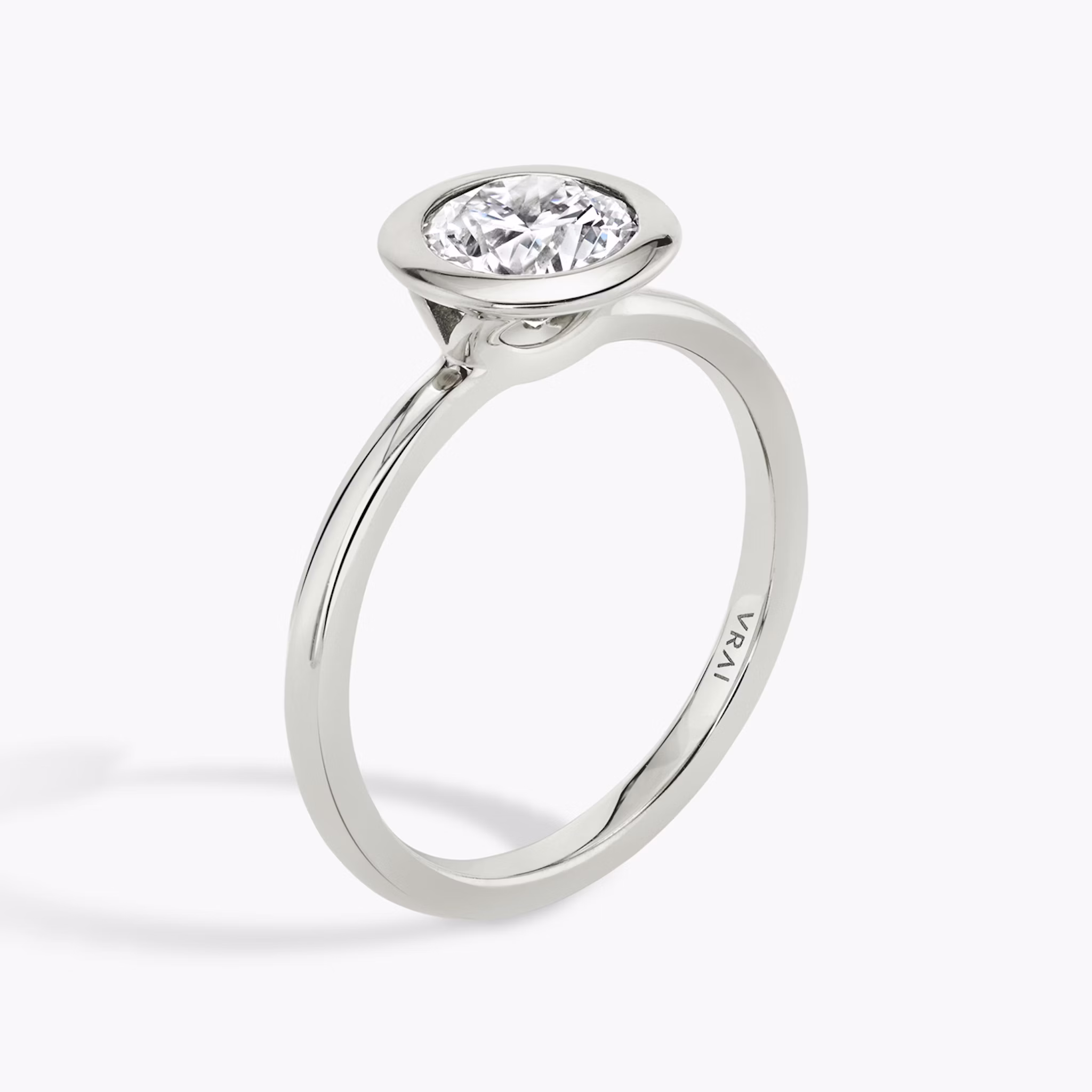 The Signature Bezel | Round Brilliant | Platinum | bandAccent: Plain | caratWeight: other | diamondOrientation: horizontal