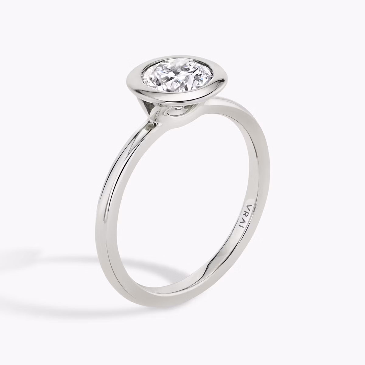 The Signature Bezel | Round Brilliant | 18k | White Gold | bandAccent: Plain | caratWeight: other | diamondOrientation: vertical