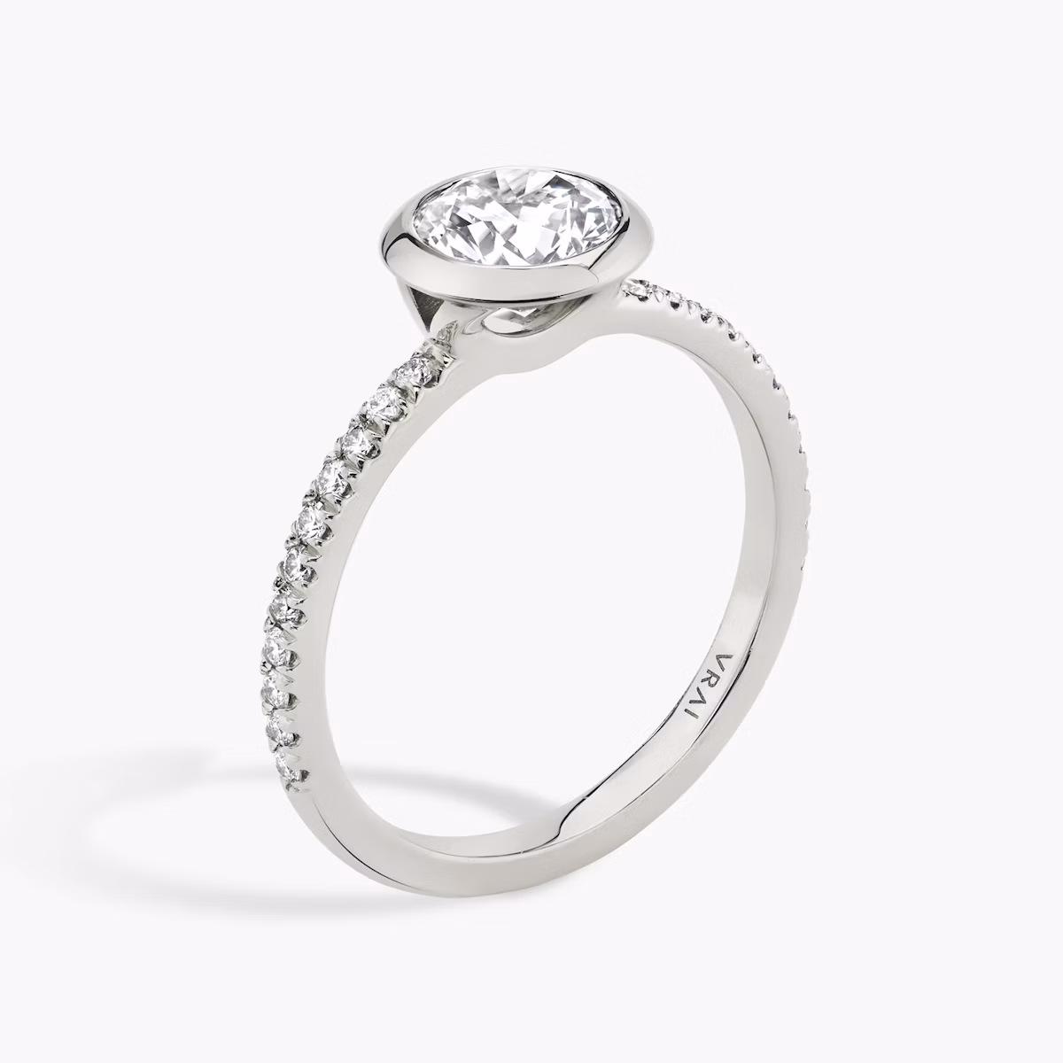 The Signature Bezel | Round Brilliant | Platinum | bandAccent: Pavé | caratWeight: other | diamondOrientation: vertical