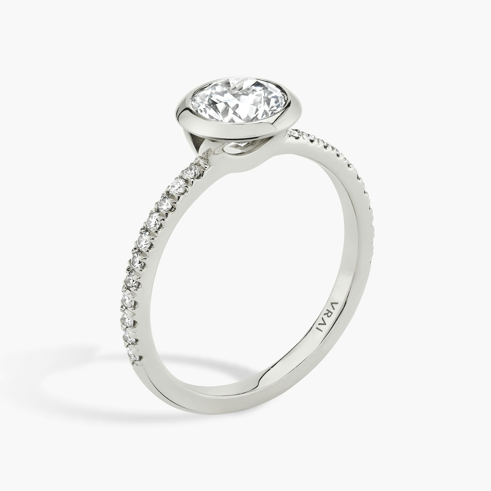 The Signature Bezel | Round Brilliant | Platinum | bandAccent: Pavé | caratWeight: 1.5ct | diamondOrientation: horizontal