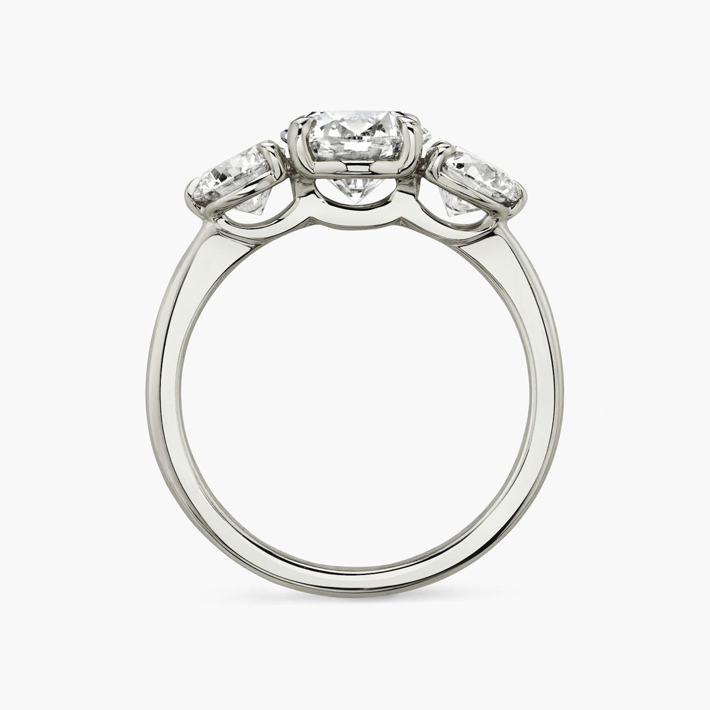 The Three Stone | Round Brilliant | Platinum | bandAccent: Plain | caratWeight: other | sideStoneCarat: 0.50ct | sideStoneShape: Round Brilliant | diamondOrientation: vertical