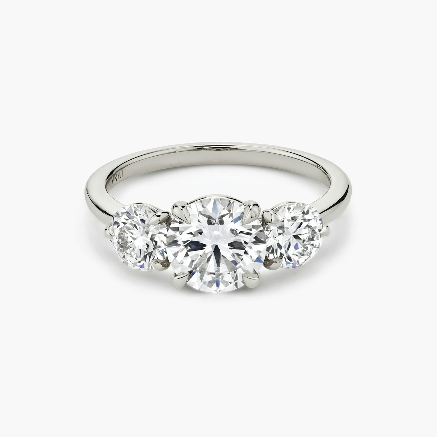 The Three Stone | Round Brilliant | 18k | White Gold | bandAccent: Plain | caratWeight: other | sideStoneCarat: 0.50ct | sideStoneShape: Round Brilliant | diamondOrientation: vertical