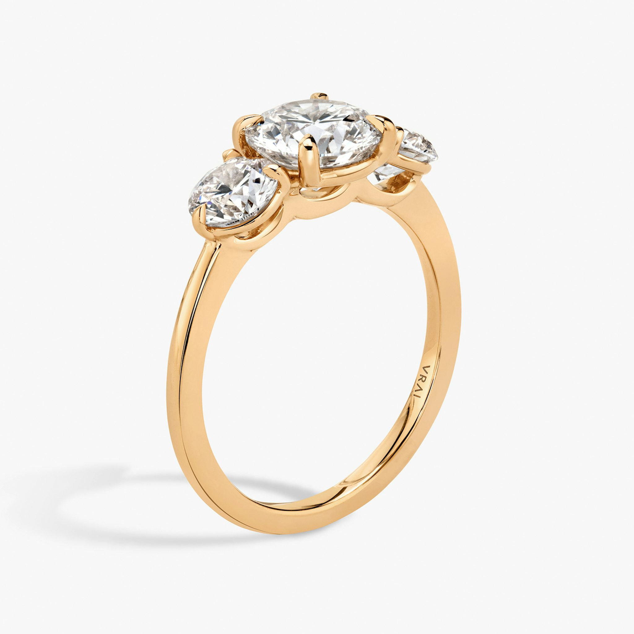 The Three Stone | Round Brilliant | 14k | Rose Gold | bandAccent: Plain | caratWeight: other | sideStoneCarat: 0.50ct | sideStoneShape: Round Brilliant | diamondOrientation: vertical