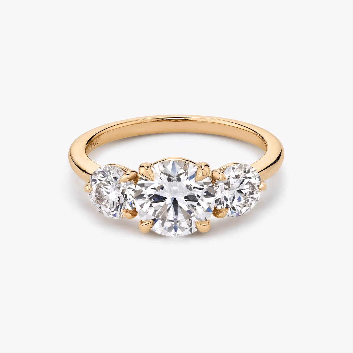 The Three Stone | Round Brilliant | 14k | Rose Gold | bandAccent: Plain | caratWeight: other | sideStoneCarat: 0.50ct | sideStoneShape: Round Brilliant | diamondOrientation: vertical