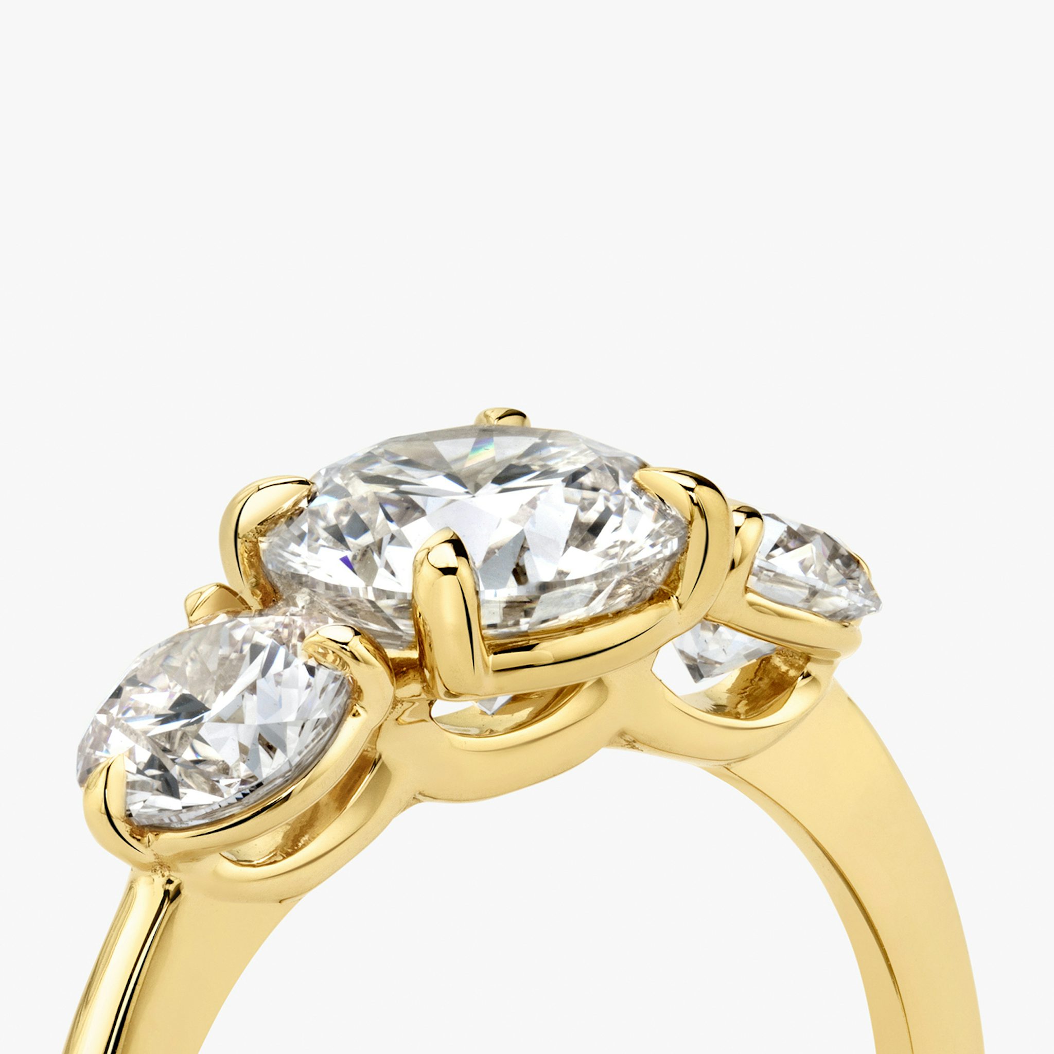 The Three Stone | Round Brilliant | 18k | Yellow Gold | bandAccent: Plain | caratWeight: other | sideStoneCarat: 0.50ct | sideStoneShape: Round Brilliant | diamondOrientation: vertical