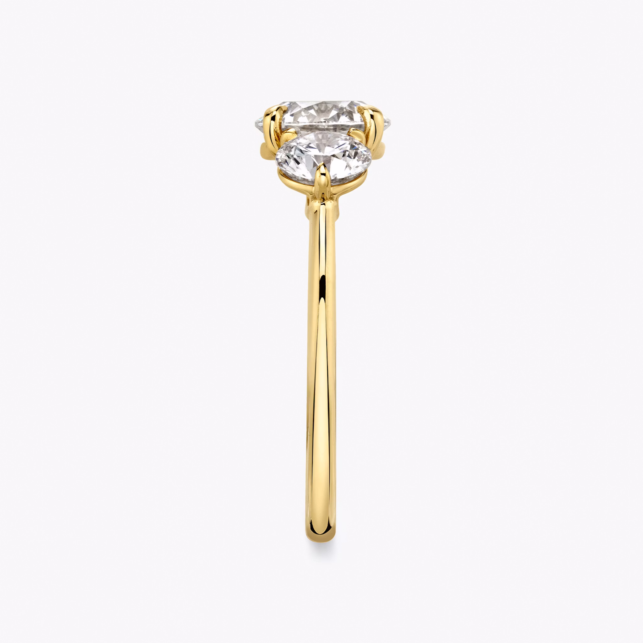 The Three Stone | Round Brilliant | 18k | Yellow Gold | bandAccent: Plain | caratWeight: other | sideStoneCarat: 0.50ct | sideStoneShape: Round Brilliant | diamondOrientation: vertical