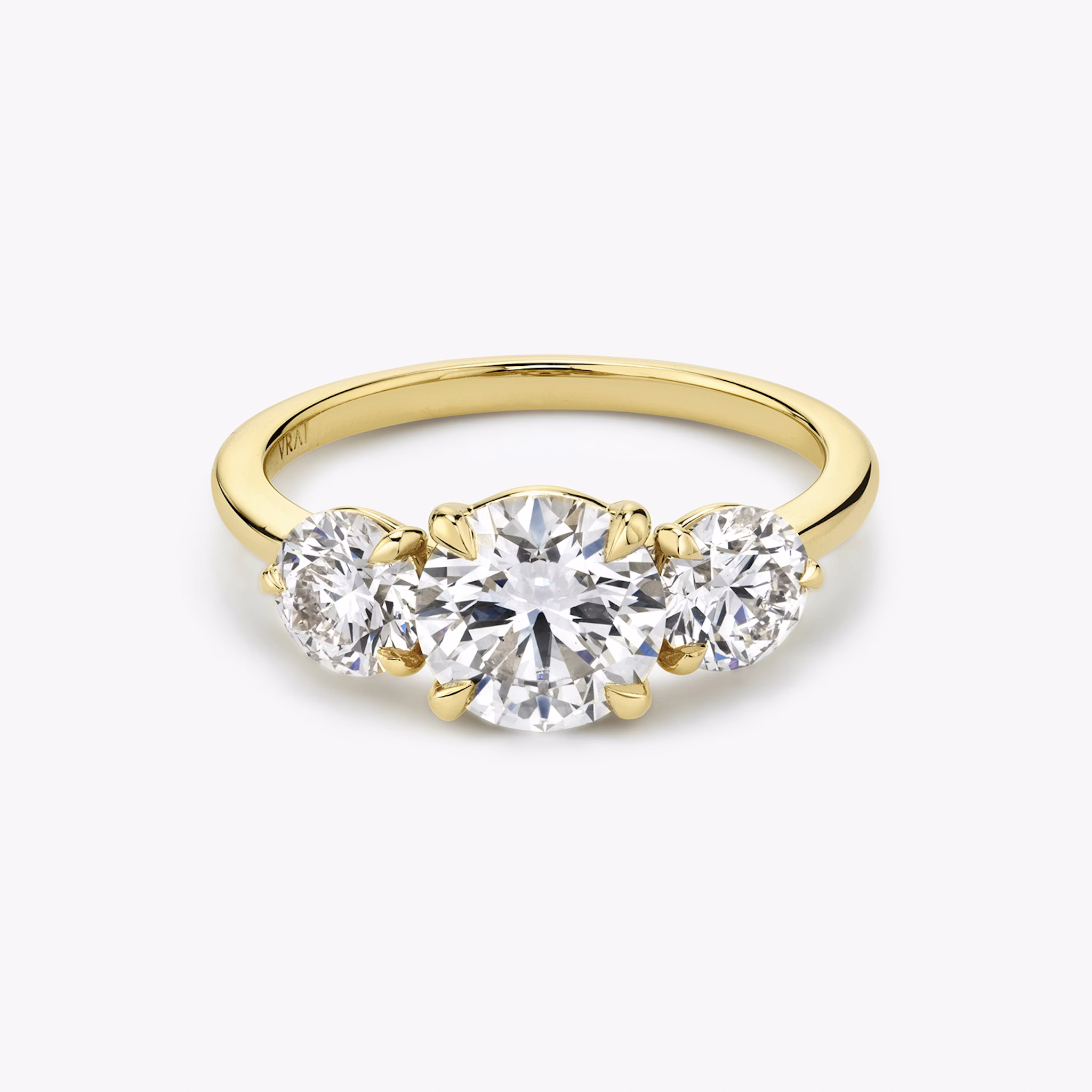The Three Stone | Round Brilliant | 18k | Yellow Gold | bandAccent: Plain | caratWeight: other | sideStoneCarat: 0.50ct | sideStoneShape: Round Brilliant | diamondOrientation: vertical