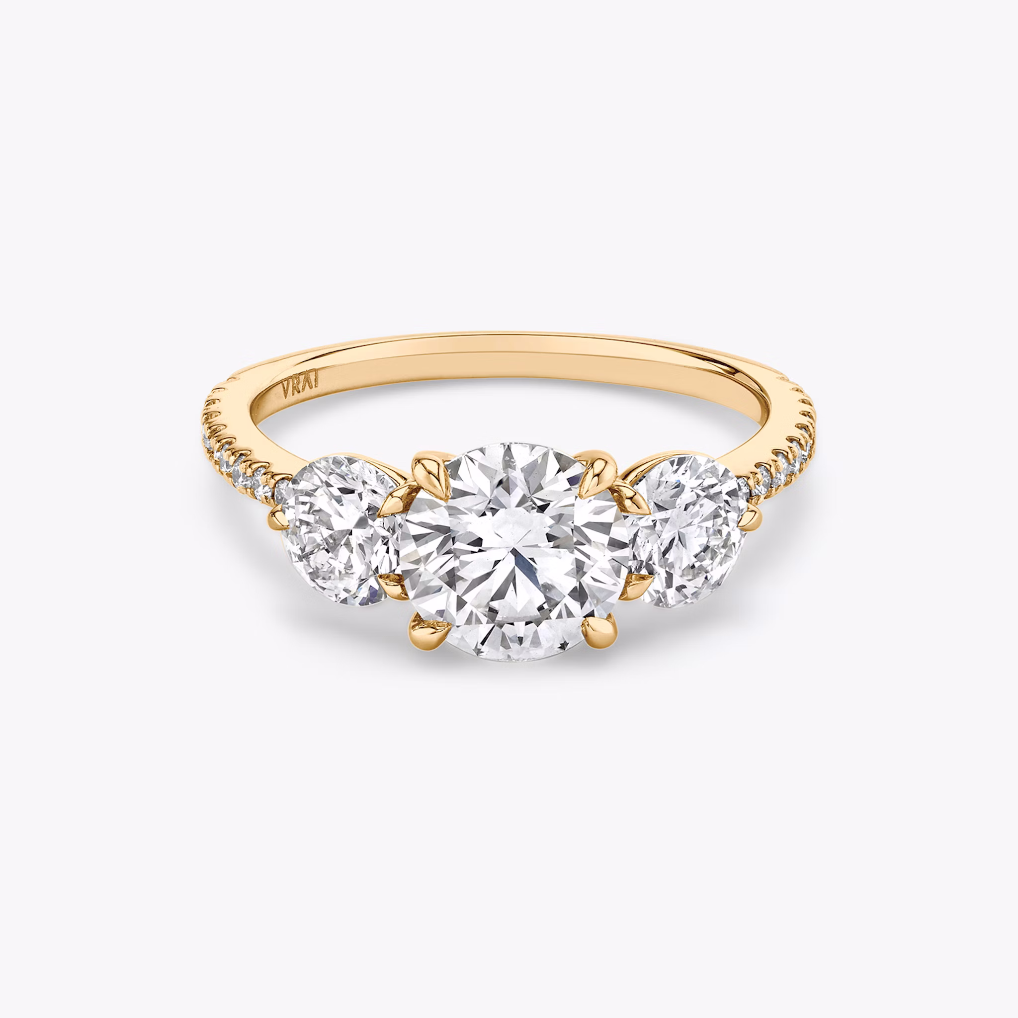 The Three Stone | Round Brilliant | 14k | Rose Gold | bandAccent: Pavé | caratWeight: other | sideStoneCarat: 0.50ct | sideStoneShape: Round Brilliant | diamondOrientation: vertical