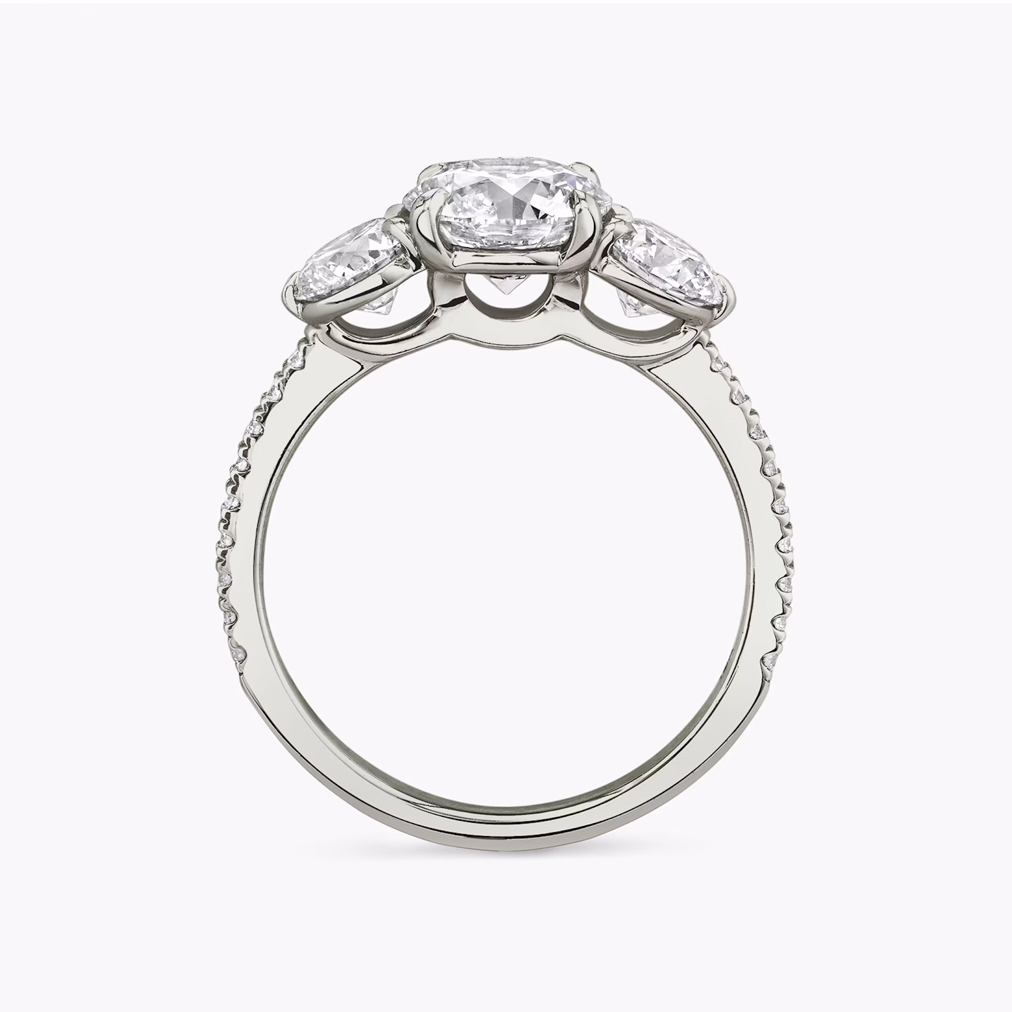 The Three Stone | Round Brilliant | 18k | White Gold | bandAccent: Pavé | caratWeight: other | sideStoneCarat: 0.50ct | sideStoneShape: Round Brilliant | diamondOrientation: vertical