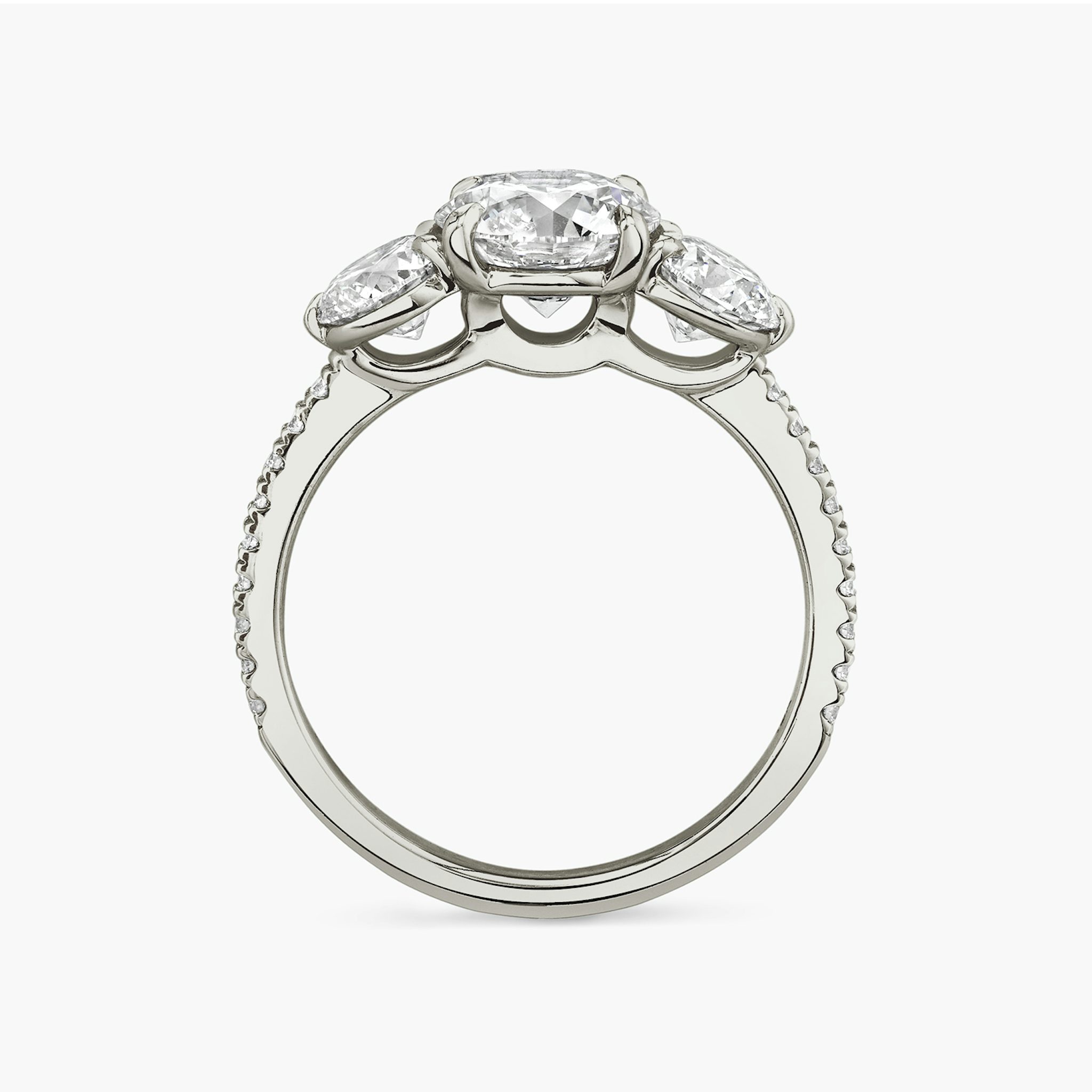 The Three Stone | Round Brilliant | 18k | White Gold | bandAccent: Pavé | caratWeight: other | sideStoneCarat: 0.50ct | sideStoneShape: Round Brilliant | diamondOrientation: vertical