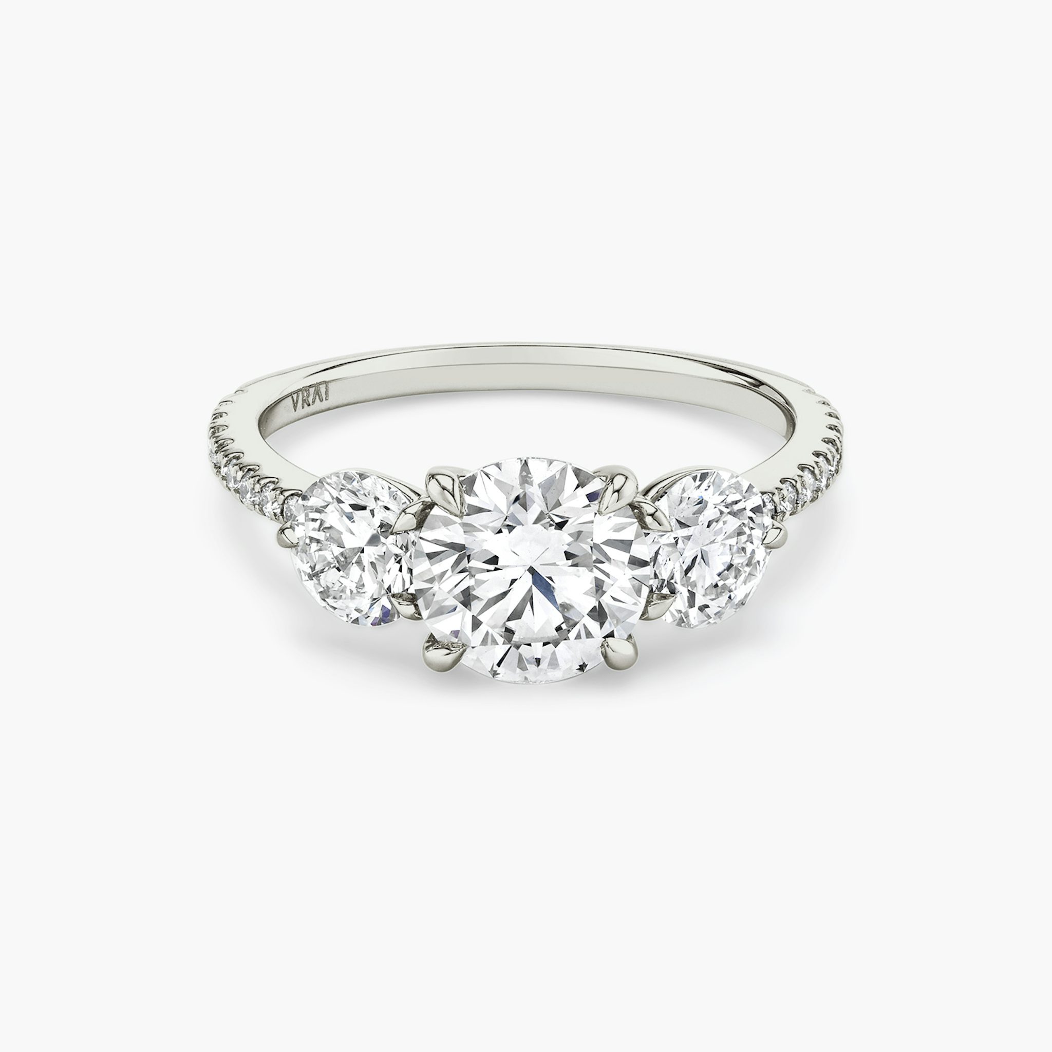 The Three Stone | Round Brilliant | 18k | White Gold | bandAccent: Pavé | caratWeight: other | sideStoneCarat: 0.50ct | sideStoneShape: Round Brilliant | diamondOrientation: vertical
