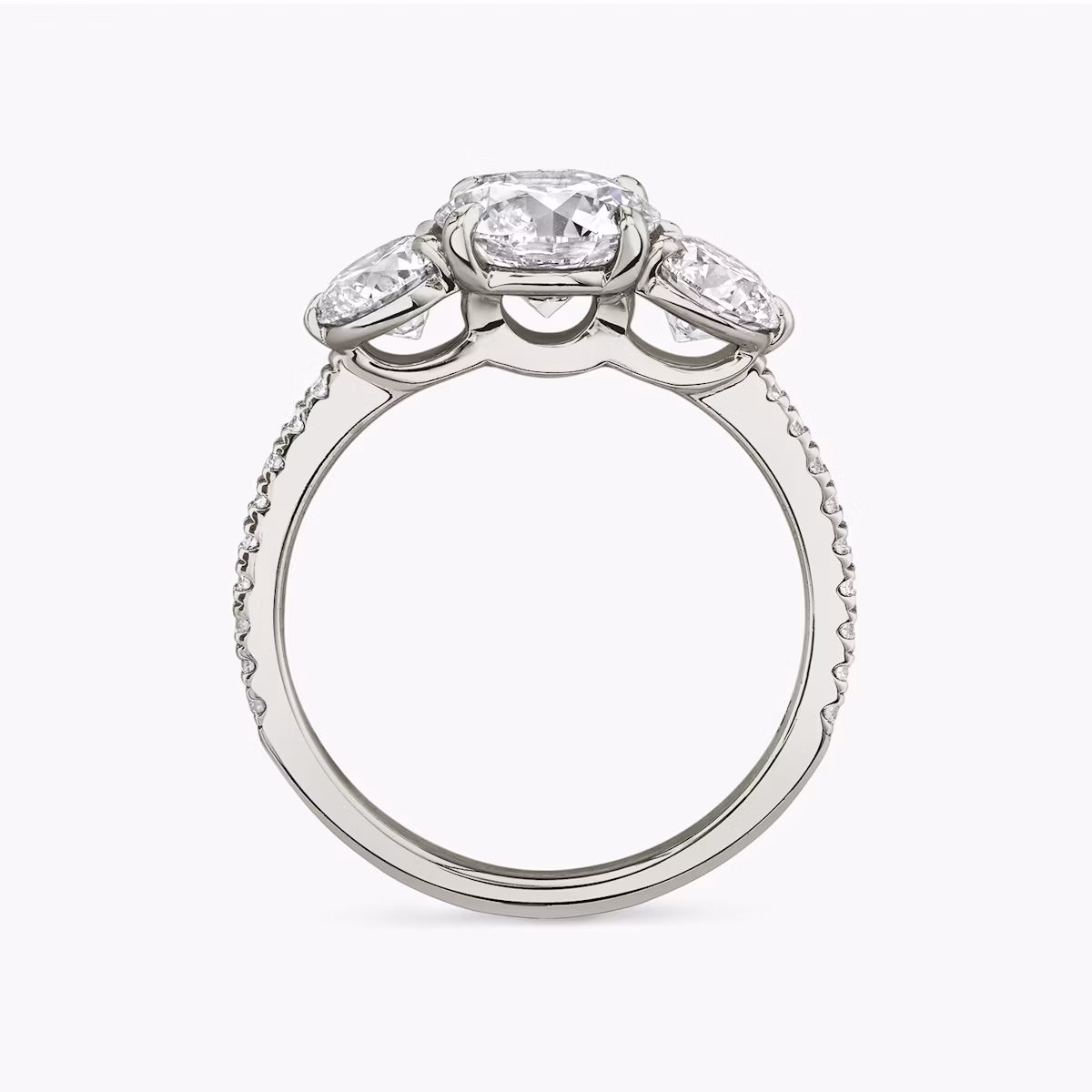 The Three Stone | Round Brilliant | Platinum | bandAccent: Pavé | caratWeight: other | sideStoneCarat: 0.50ct | sideStoneShape: Round Brilliant | diamondOrientation: vertical