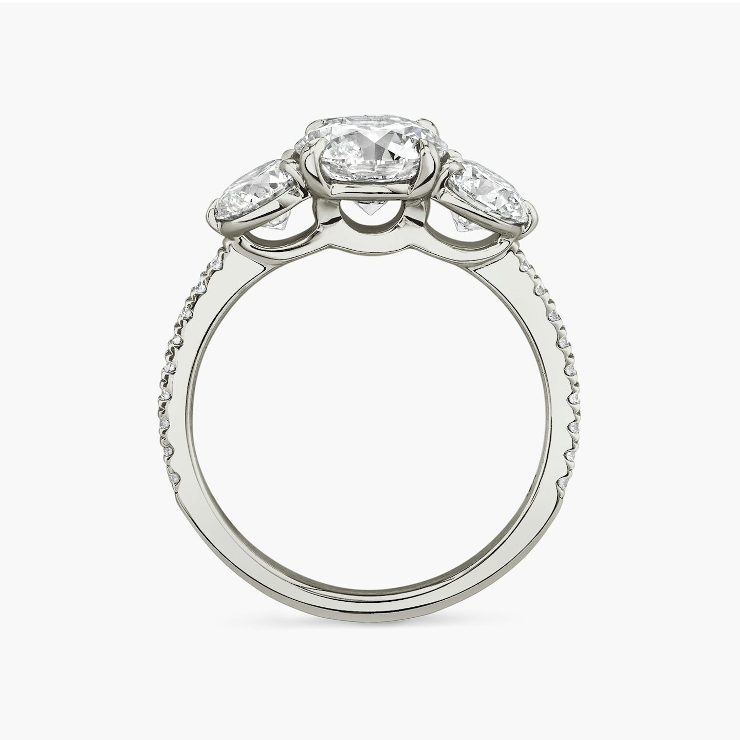 The Three Stone | Round Brilliant | Platinum | bandAccent: Pavé | caratWeight: other | sideStoneCarat: 0.50ct | sideStoneShape: Round Brilliant | diamondOrientation: vertical