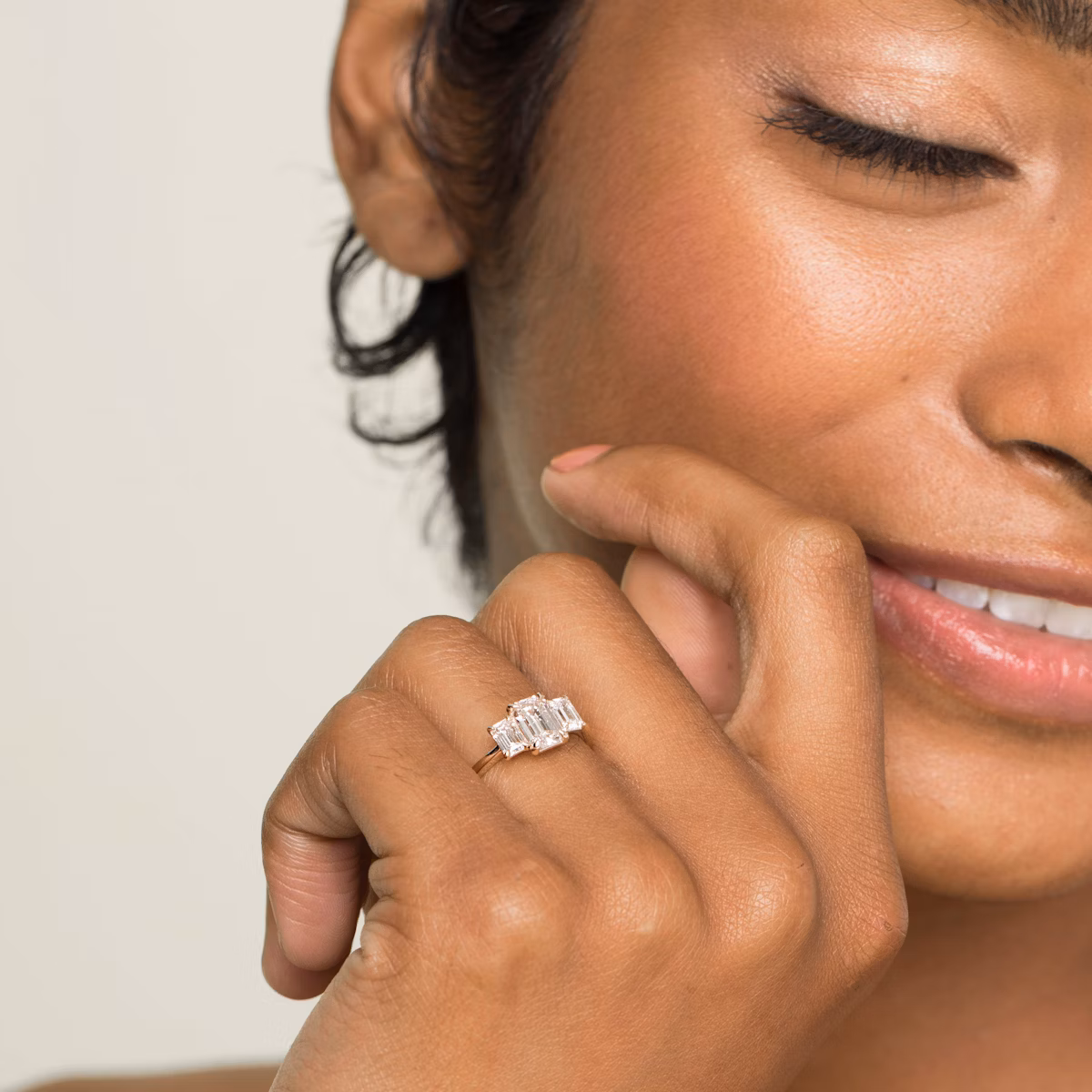 The Three Stone | Emerald | Platinum | bandAccent: Plain | sideStoneCarat: 0.25ct | sideStoneShape: Emerald | diamondOrientation: vertical | caratWeight: other