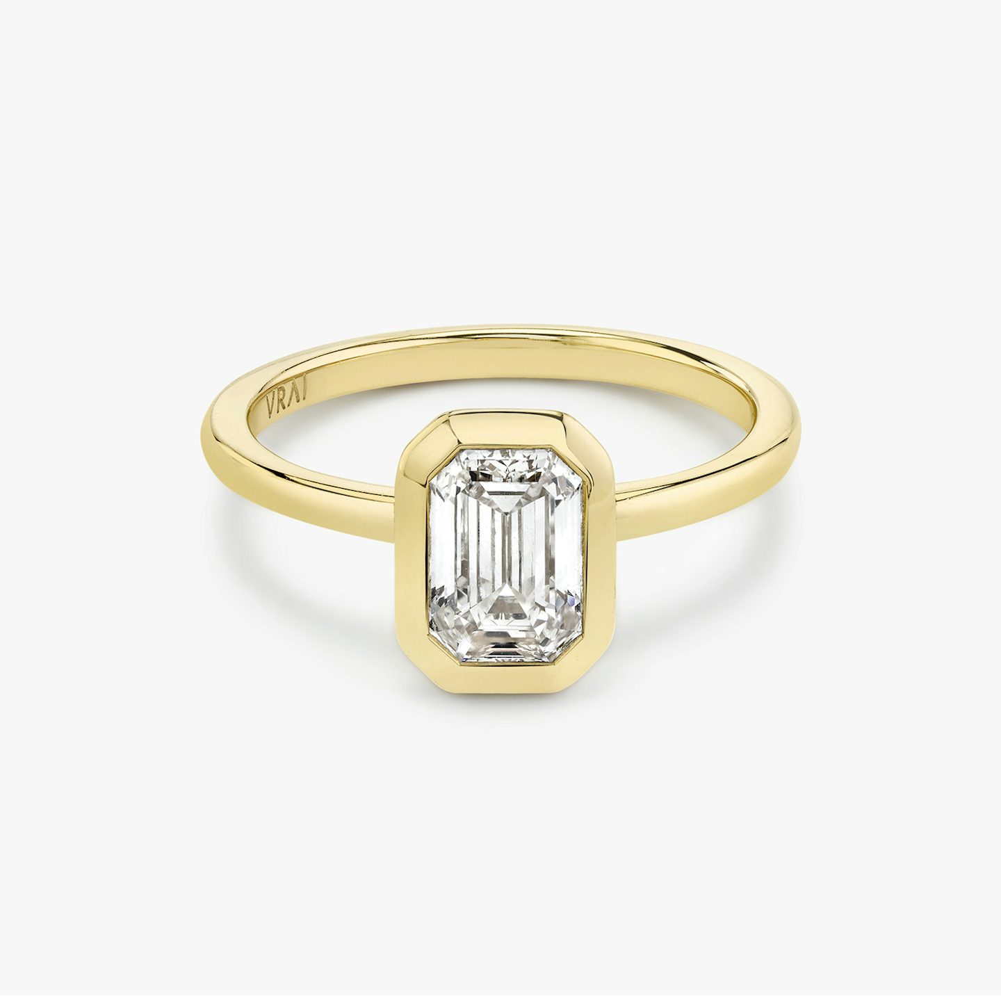 Signature bezel emerald cut engagement ring