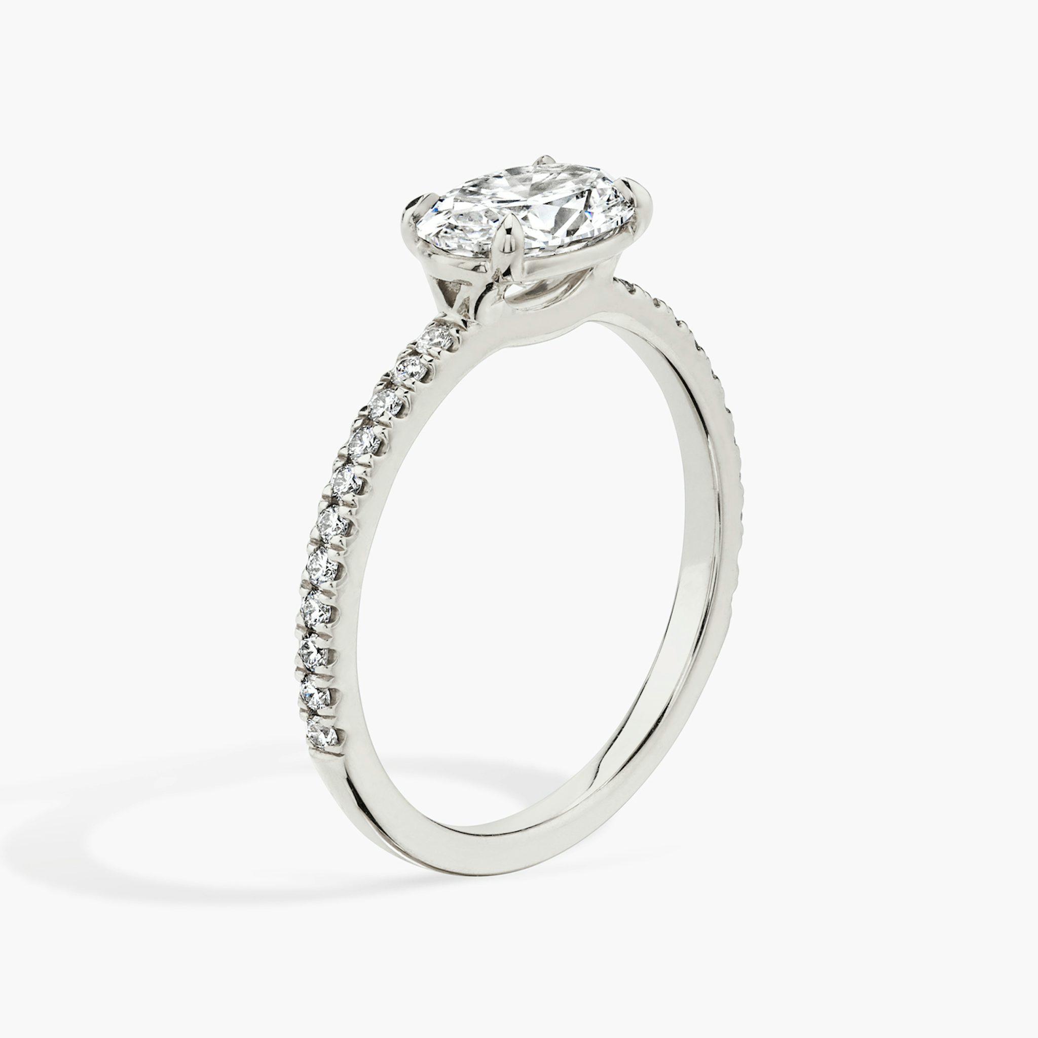 The Signature | Oval | 18k | White Gold | bandAccent: Pavé | bandWidth: standard | diamondOrientation: horizontal | hiddenHalo: no | caratWeight: other