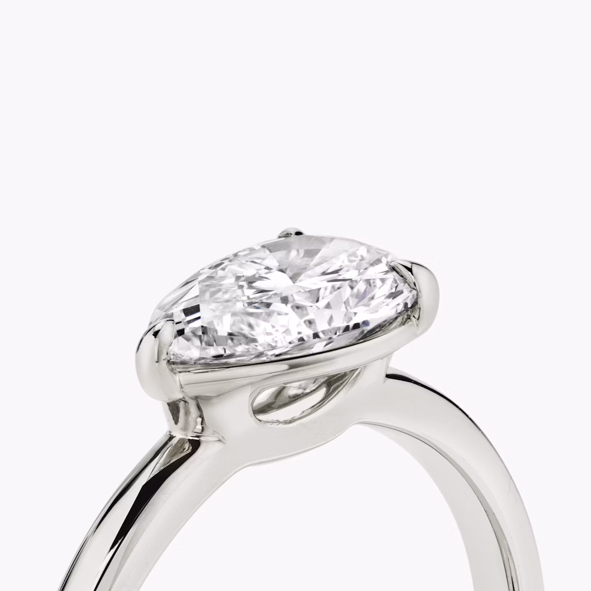 The Signature | Pear | Platinum | bandAccent: Plain | bandWidth: standard | diamondOrientation: horizontal | hiddenHalo: no | caratWeight: other