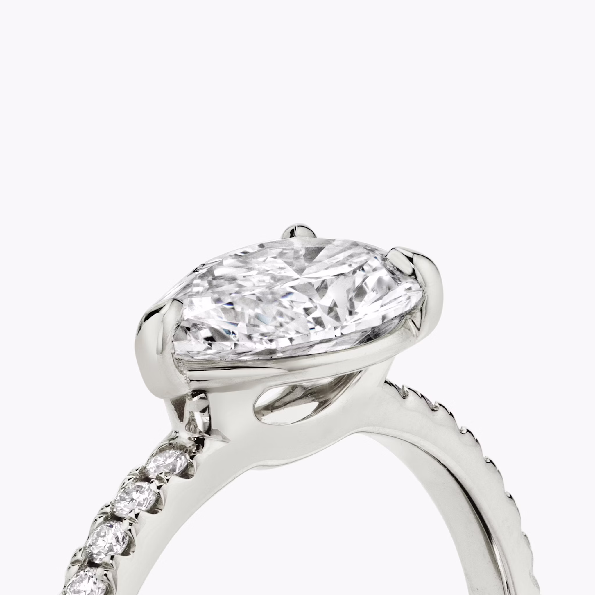 The Signature | Pear | Platinum | bandAccent: Pavé | bandWidth: standard | diamondOrientation: horizontal | hiddenHalo: no | caratWeight: other