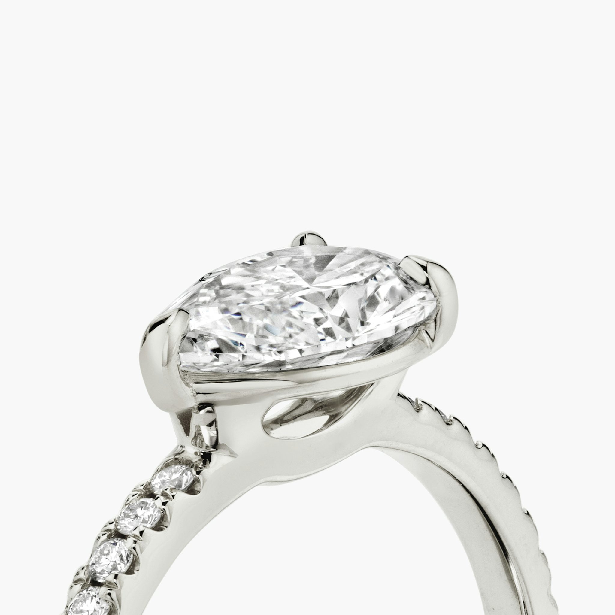 The Signature | Pear | Platinum | bandAccent: Pavé | bandWidth: standard | diamondOrientation: horizontal | hiddenHalo: no | caratWeight: other