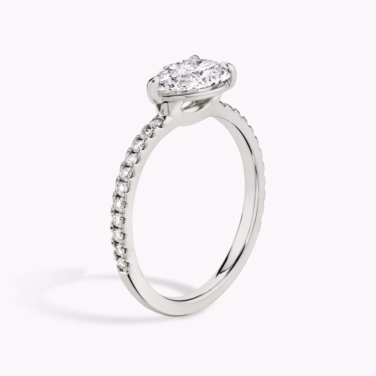 The Signature | Pear | Platinum | bandAccent: Pavé | bandWidth: standard | diamondOrientation: horizontal | hiddenHalo: no | caratWeight: other