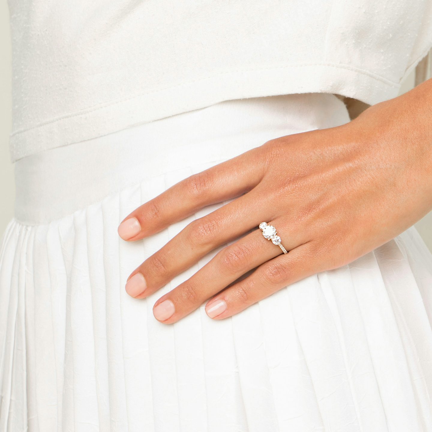 The Three Stone | Round Brilliant | 18k | White Gold | bandAccent: Pavé | caratWeight: other | sideStoneCarat: 0.25ct | sideStoneShape: Round Brilliant | diamondOrientation: vertical