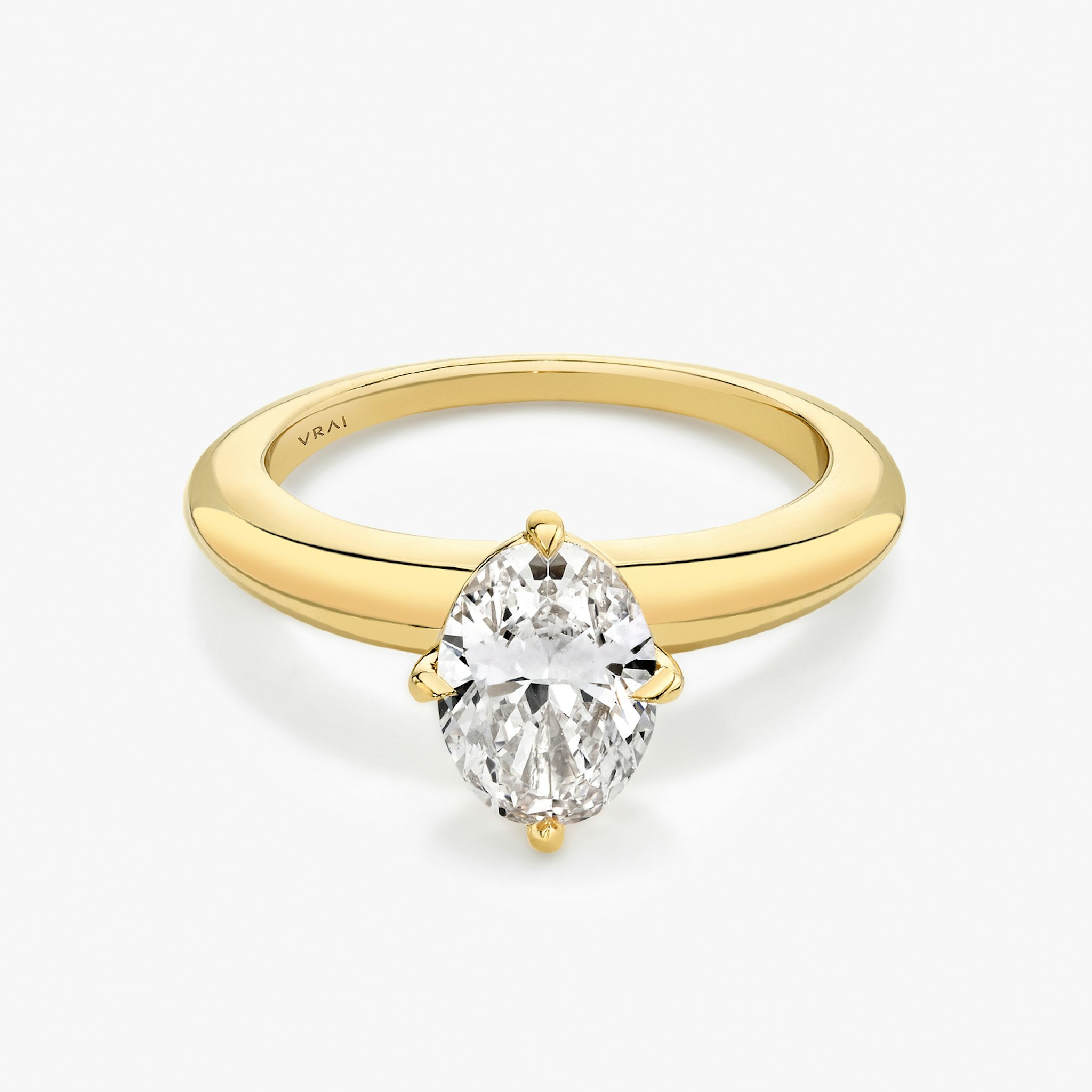 Yellow gold rounded band with an oval shaped diamond