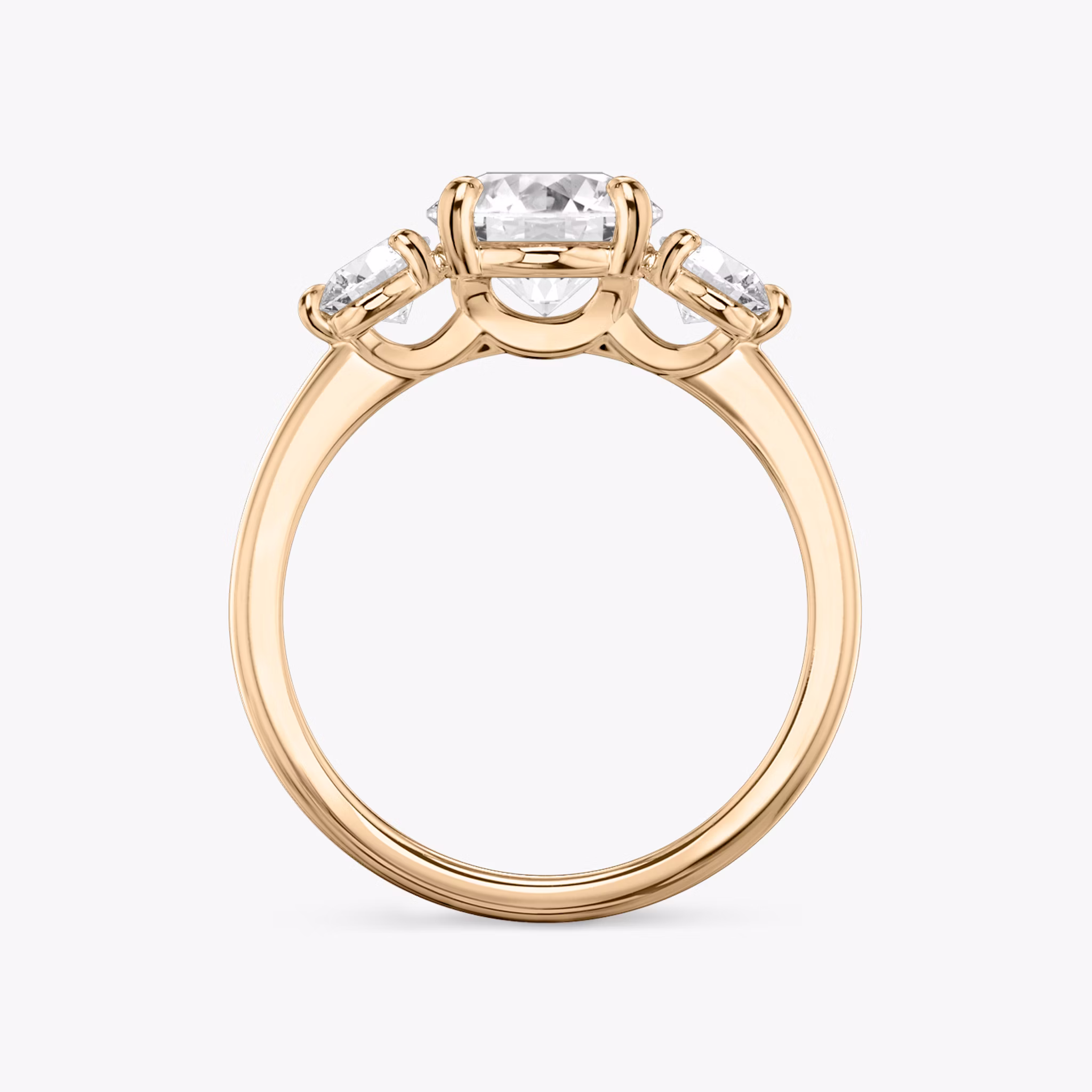 The Three Stone | Round Brilliant | 14k | Rose Gold | bandAccent: Plain | caratWeight: other | sideStoneCarat: 0.25ct | sideStoneShape: Round Brilliant | diamondOrientation: vertical