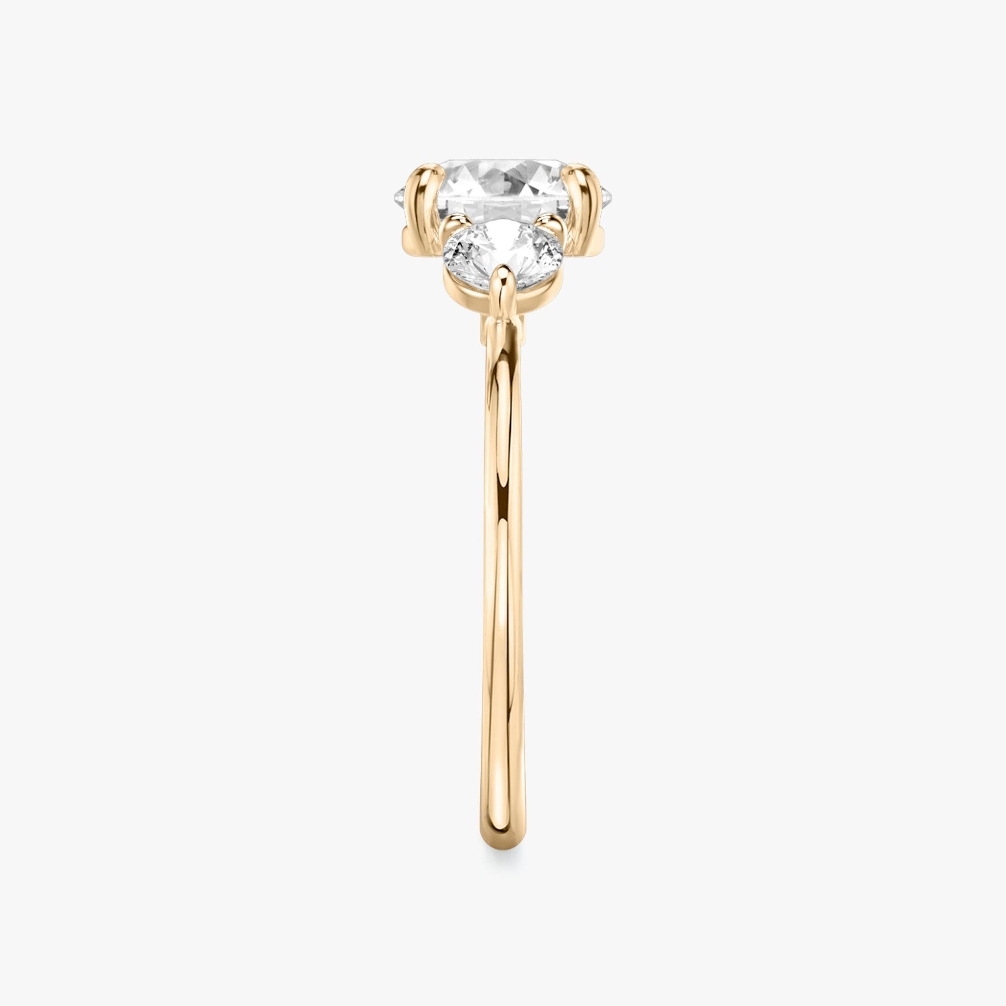 The Three Stone | Round Brilliant | 14k | Rose Gold | bandAccent: Plain | caratWeight: other | sideStoneCarat: 0.25ct | sideStoneShape: Round Brilliant | diamondOrientation: vertical