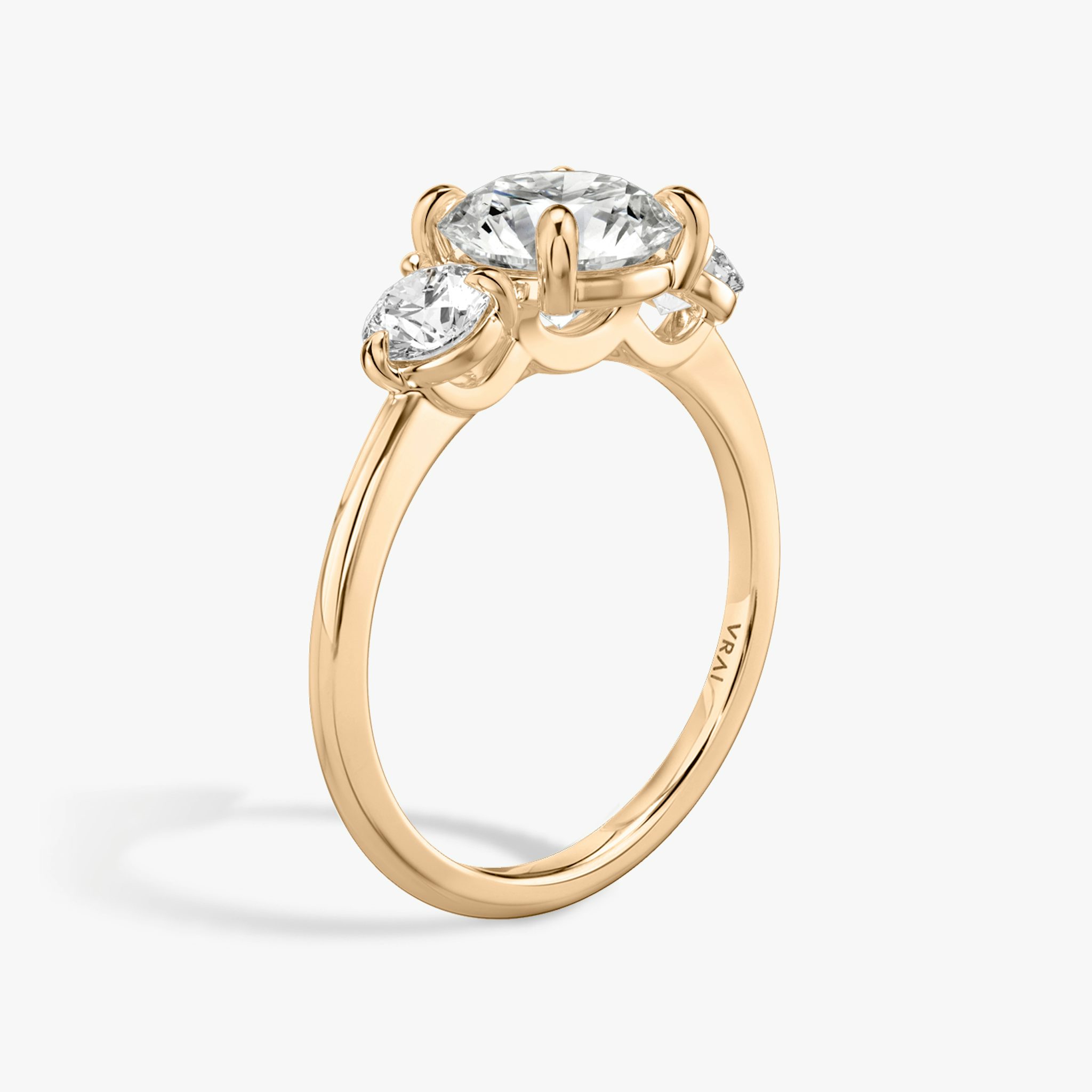 The Three Stone | Round Brilliant | 14k | Rose Gold | bandAccent: Plain | caratWeight: other | sideStoneCarat: 0.25ct | sideStoneShape: Round Brilliant | diamondOrientation: vertical