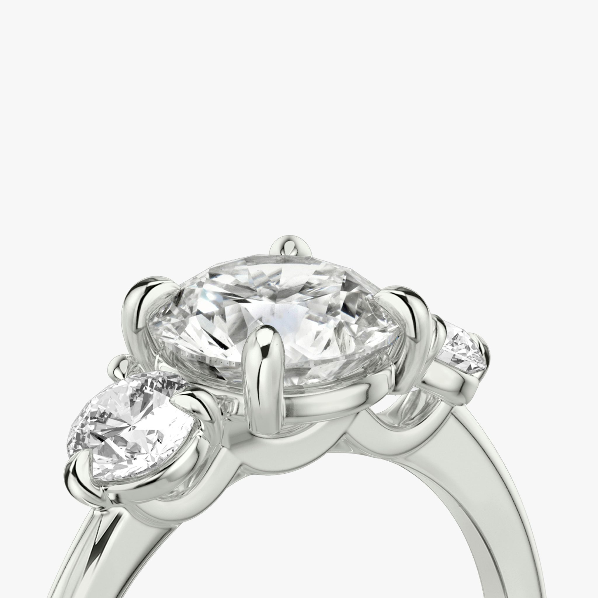 The Three Stone | Round Brilliant | 18k | White Gold | bandAccent: Plain | caratWeight: other | sideStoneCarat: 0.25ct | sideStoneShape: Round Brilliant | diamondOrientation: vertical