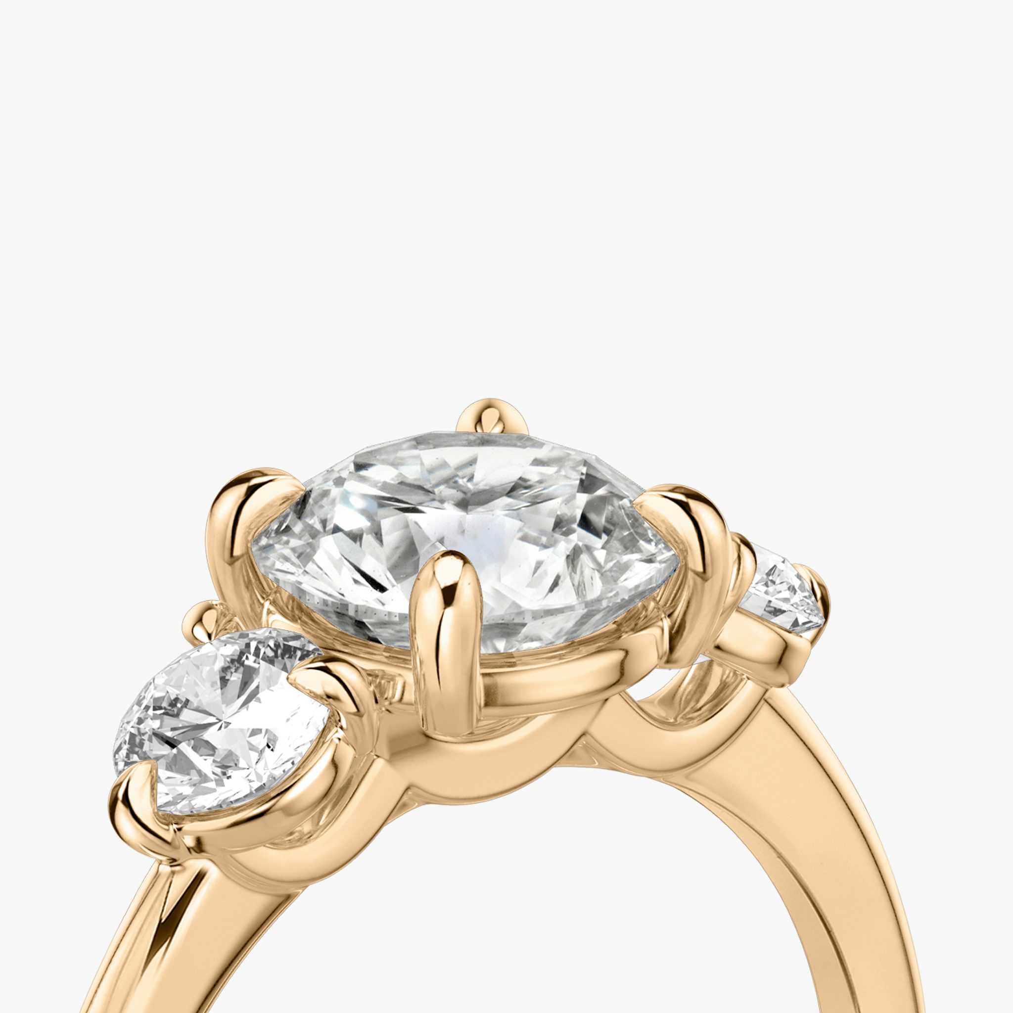 The Three Stone | Round Brilliant | 14k | Rose Gold | bandAccent: Plain | caratWeight: other | sideStoneCarat: 0.25ct | sideStoneShape: Round Brilliant | diamondOrientation: vertical