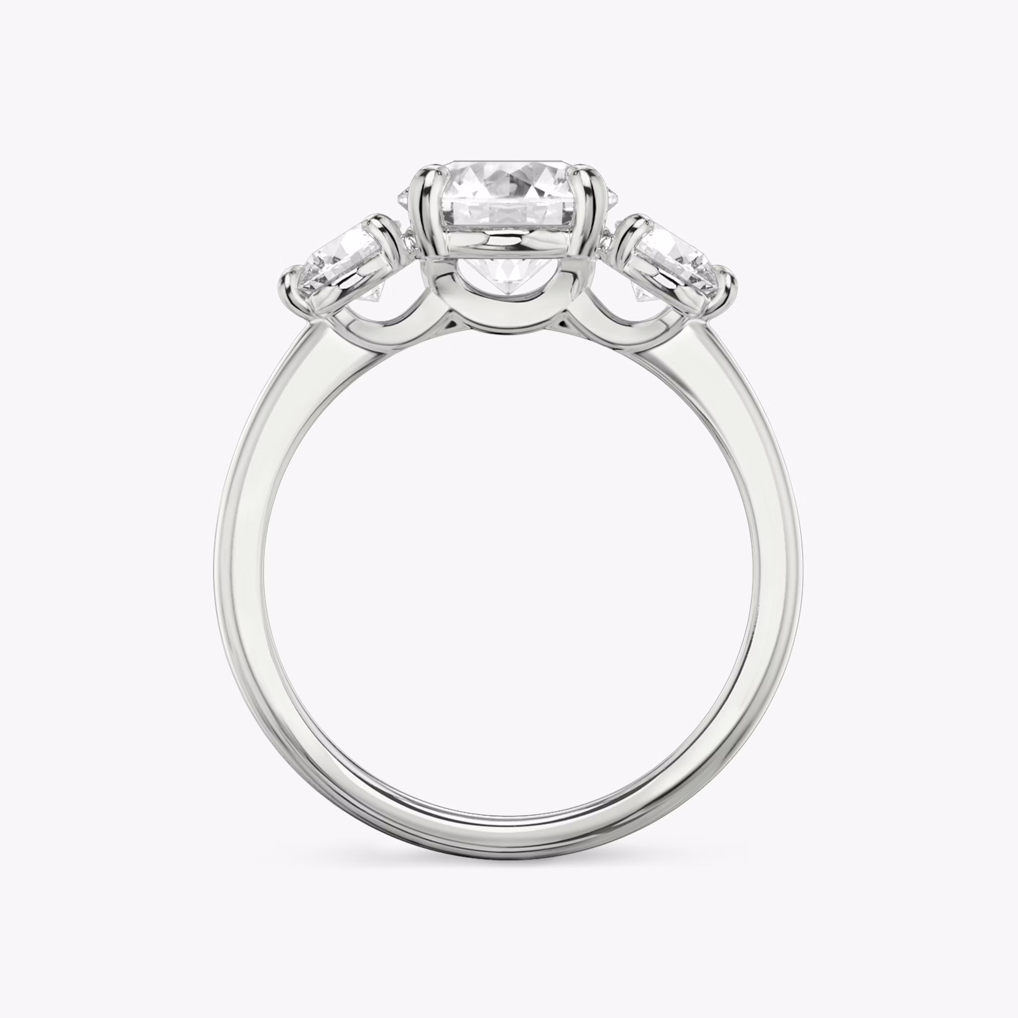 The Three Stone | Round Brilliant | Platinum | bandAccent: Plain | caratWeight: other | sideStoneCarat: 0.25ct | sideStoneShape: Round Brilliant | diamondOrientation: vertical