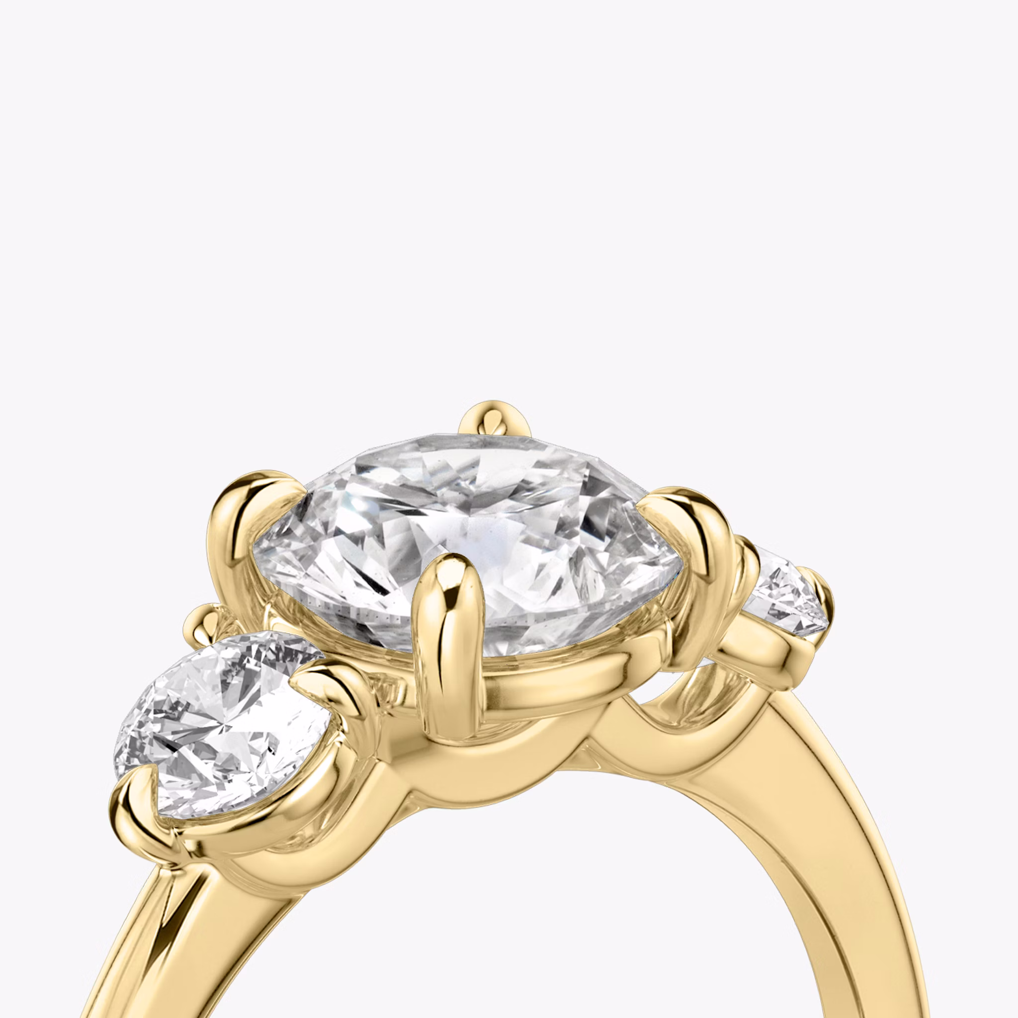 The Three Stone | Round Brilliant | 18k | Yellow Gold | bandAccent: Plain | caratWeight: other | sideStoneCarat: 0.25ct | sideStoneShape: Round Brilliant | diamondOrientation: vertical
