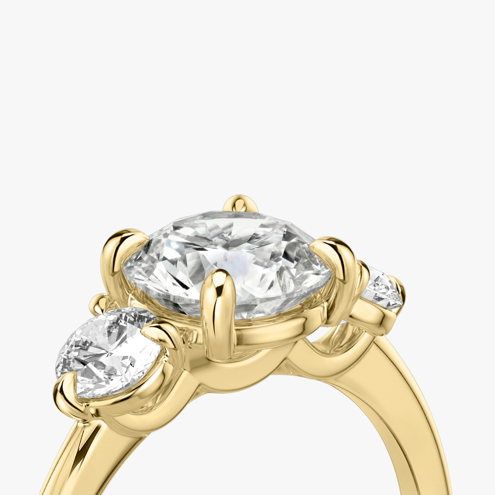 The Three Stone | Round Brilliant | 18k | Yellow Gold | bandAccent: Plain | caratWeight: other | sideStoneCarat: 0.25ct | sideStoneShape: Round Brilliant | diamondOrientation: vertical