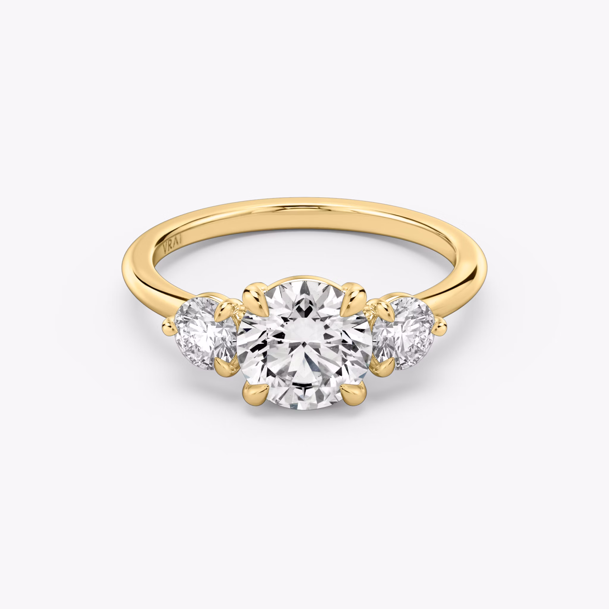 The Three Stone | Round Brilliant | 18k | Yellow Gold | bandAccent: Plain | caratWeight: other | sideStoneCarat: 0.25ct | sideStoneShape: Round Brilliant | diamondOrientation: vertical