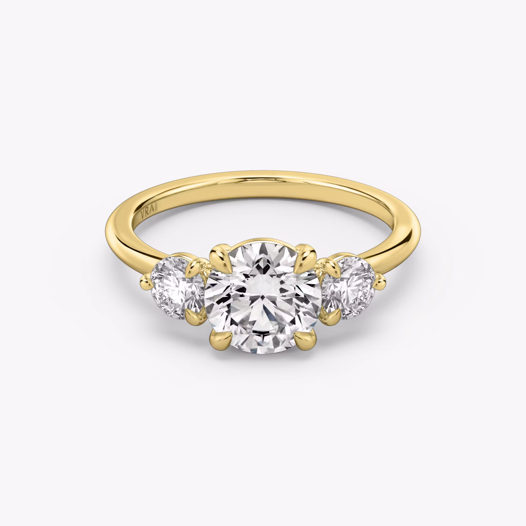 The Three Stone Round Brilliant | Yellow Gold