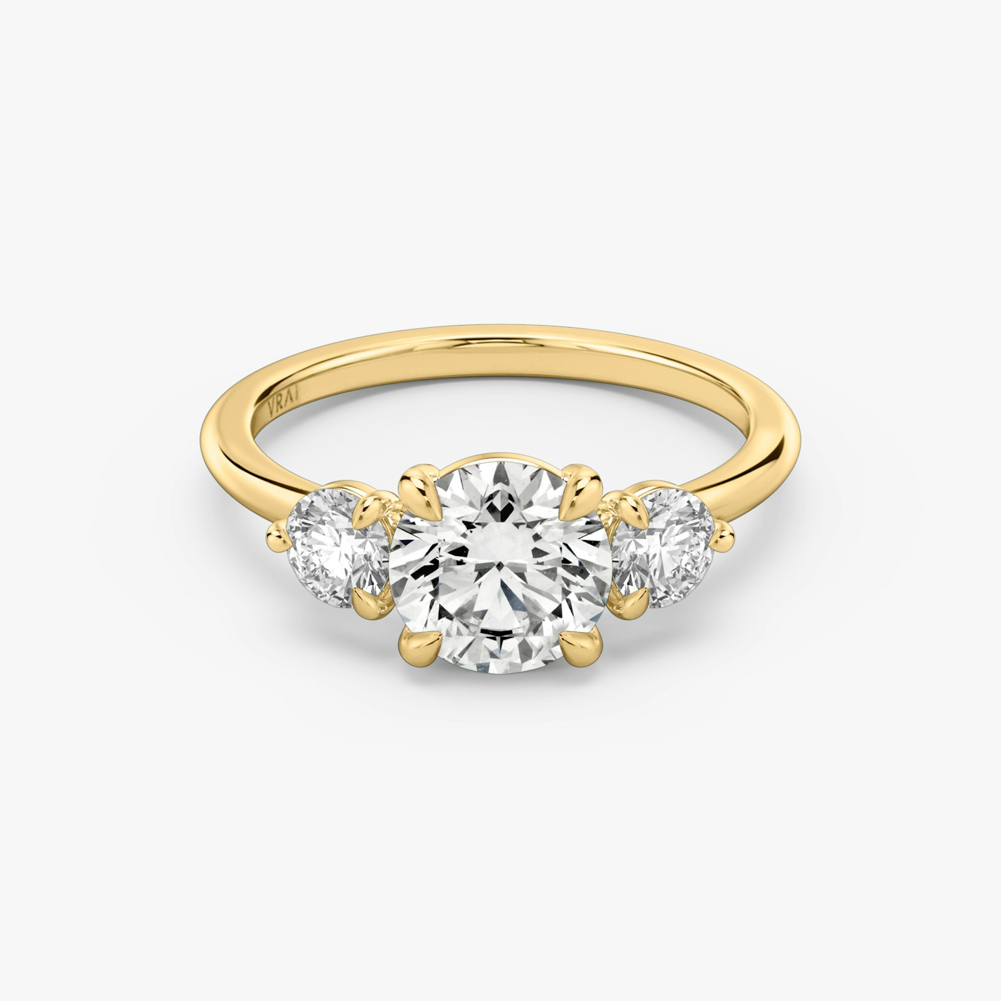 The Three Stone | Round Brilliant | 18k | Yellow Gold | bandAccent: Plain | caratWeight: other | sideStoneCarat: 0.25ct | sideStoneShape: Round Brilliant | diamondOrientation: vertical