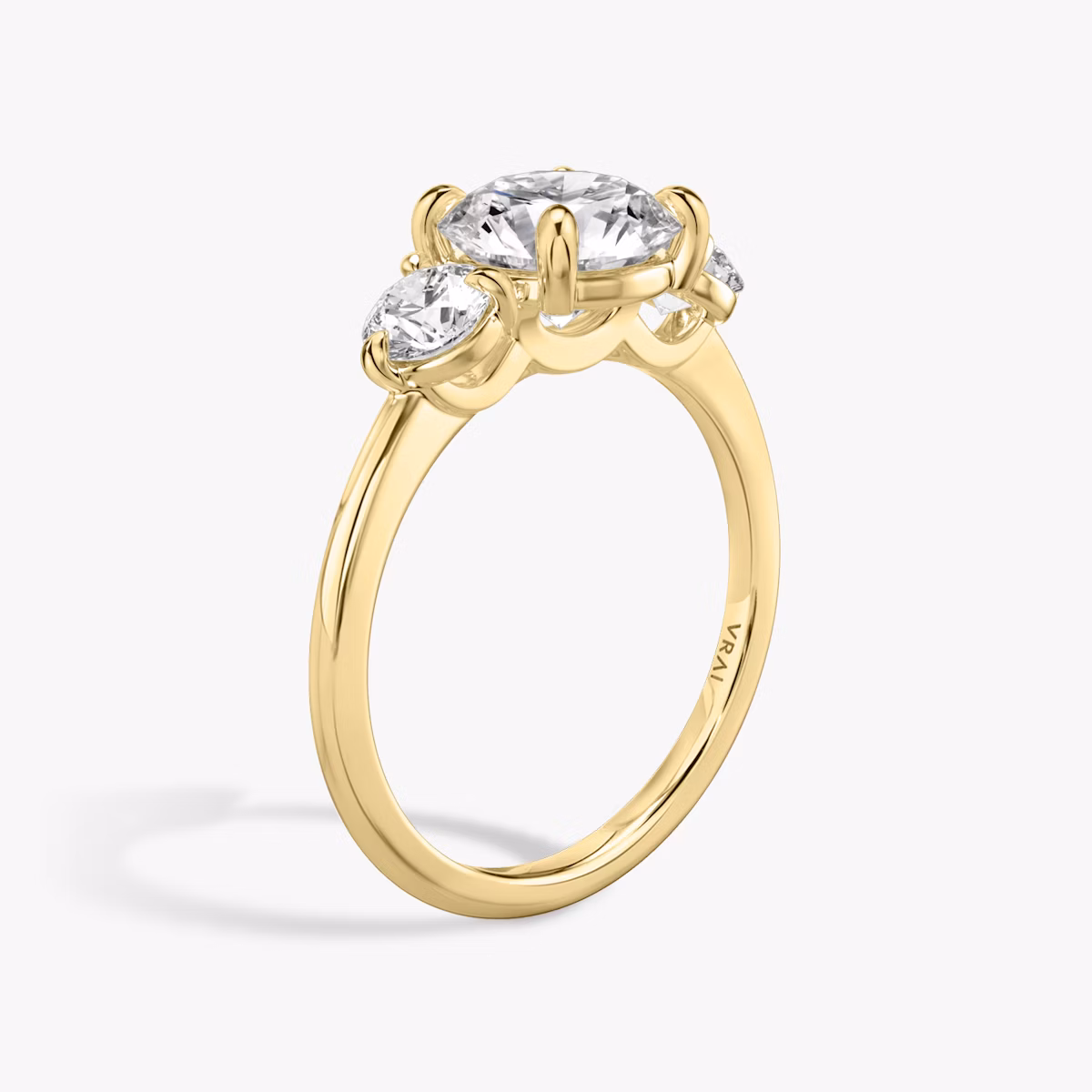The Three Stone | Round Brilliant | 18k | Yellow Gold | bandAccent: Plain | caratWeight: other | sideStoneCarat: 0.25ct | sideStoneShape: Round Brilliant | diamondOrientation: vertical