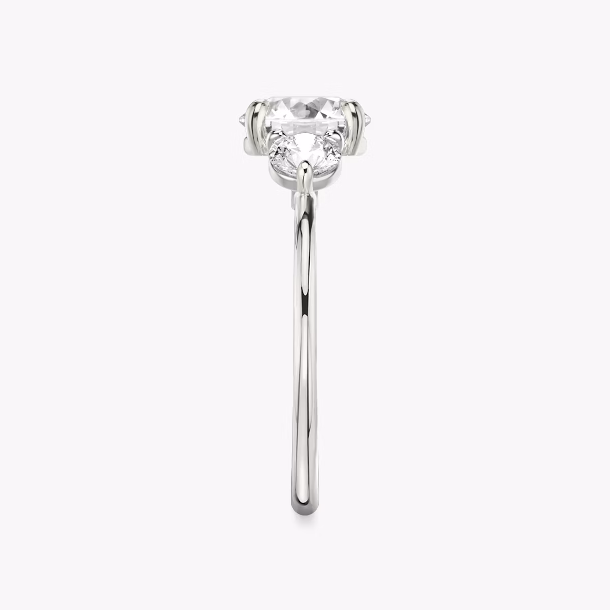 The Three Stone | Round Brilliant | Platinum | bandAccent: Plain | caratWeight: other | sideStoneCarat: 0.25ct | sideStoneShape: Round Brilliant | diamondOrientation: vertical