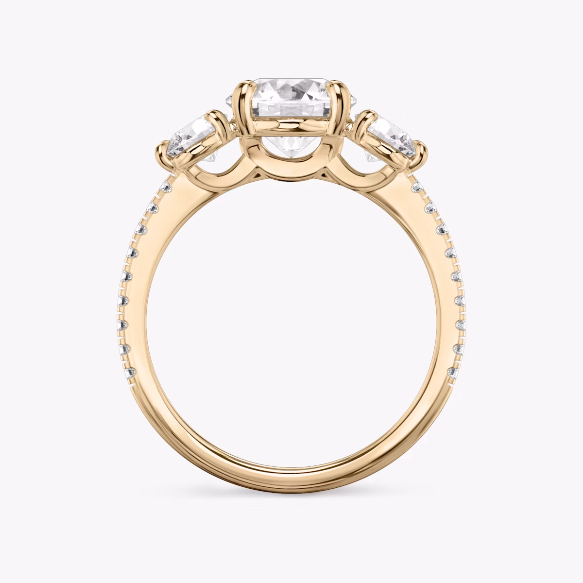 The Three Stone | Round Brilliant | 14k | Rose Gold | bandAccent: Pavé | caratWeight: other | sideStoneCarat: 0.25ct | sideStoneShape: Round Brilliant | diamondOrientation: vertical