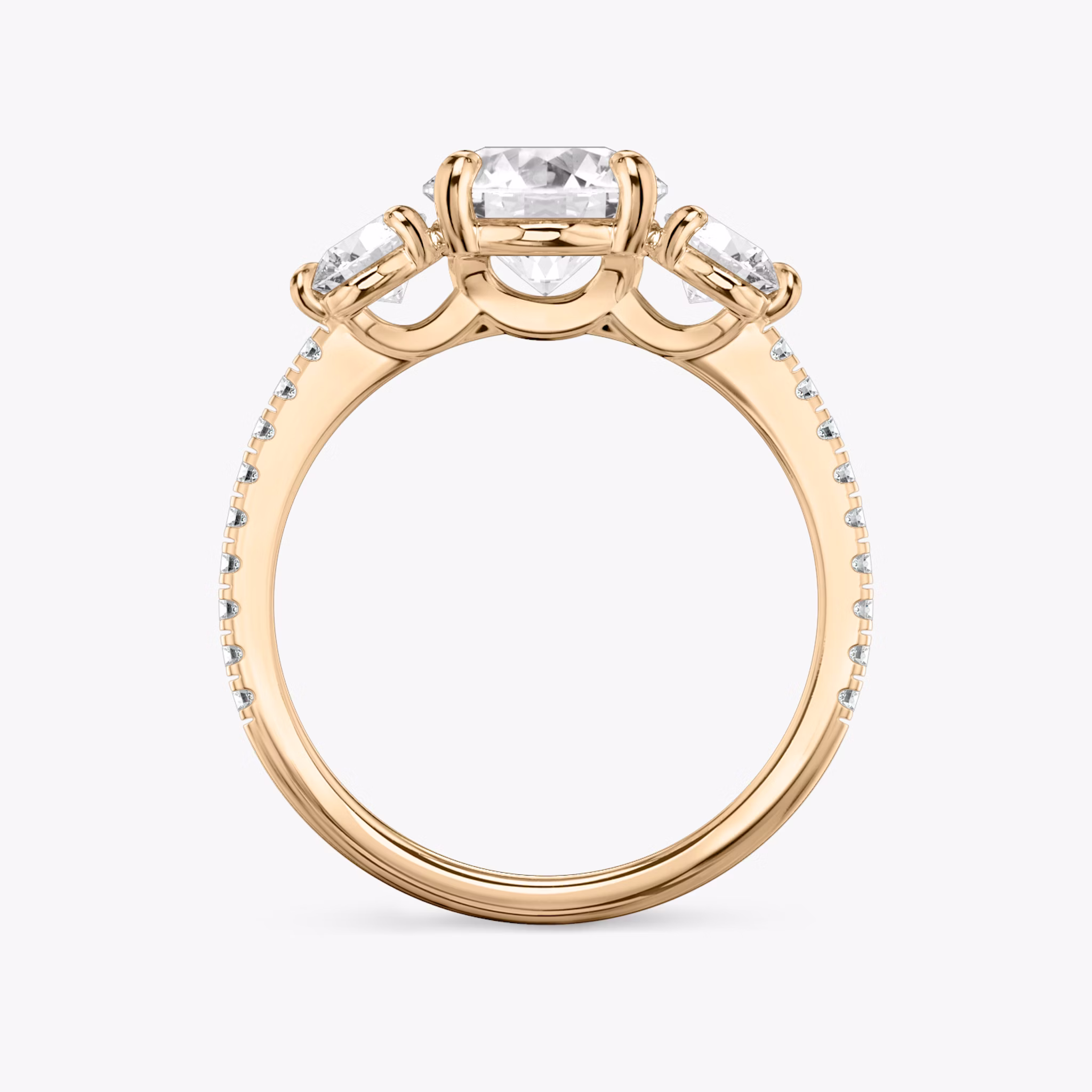 The Three Stone | Round Brilliant | 14k | Rose Gold | bandAccent: Pavé | caratWeight: other | sideStoneCarat: 0.25ct | sideStoneShape: Round Brilliant | diamondOrientation: vertical