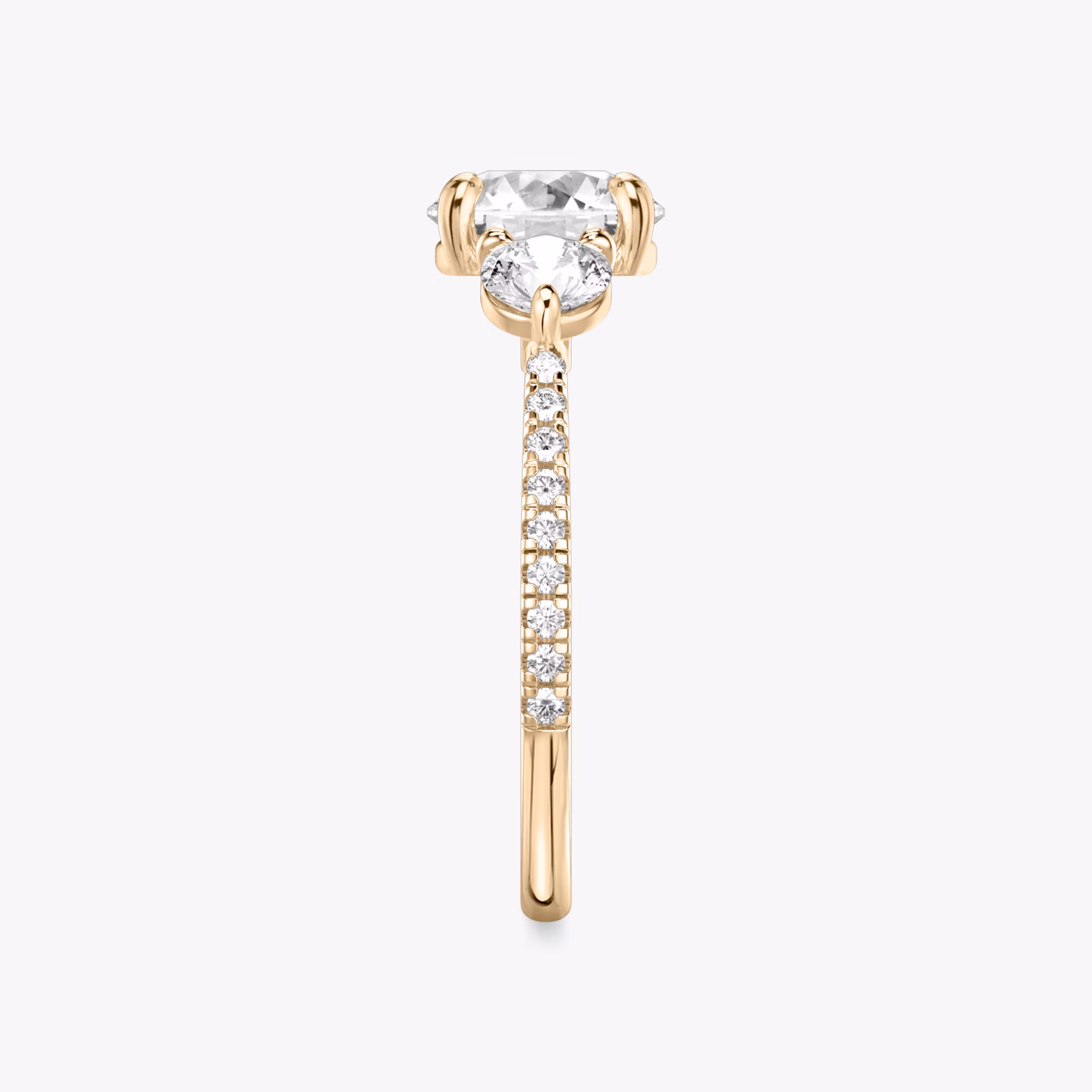 The Three Stone | Round Brilliant | 14k | Rose Gold | bandAccent: Pavé | caratWeight: other | sideStoneCarat: 0.25ct | sideStoneShape: Round Brilliant | diamondOrientation: vertical