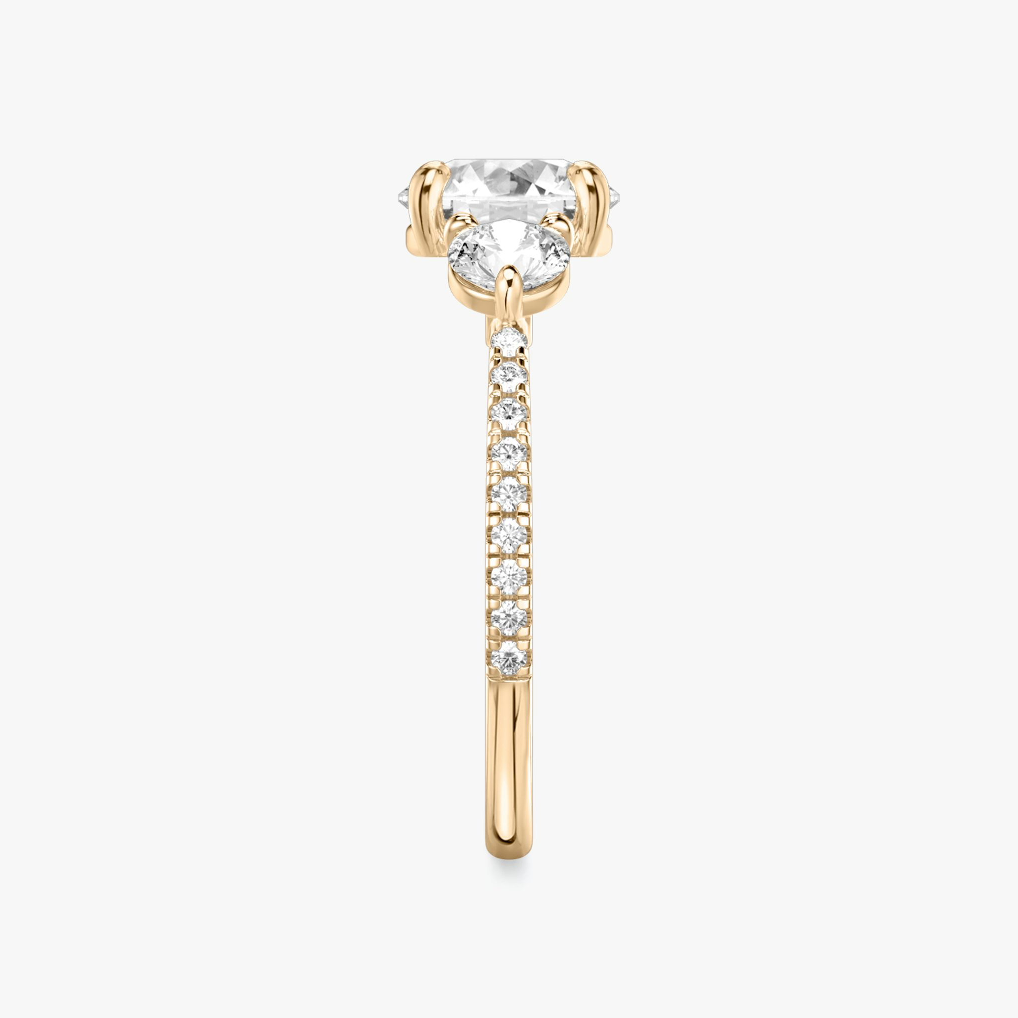 The Three Stone | Round Brilliant | 14k | Rose Gold | bandAccent: Pavé | caratWeight: other | sideStoneCarat: 0.25ct | sideStoneShape: Round Brilliant | diamondOrientation: vertical