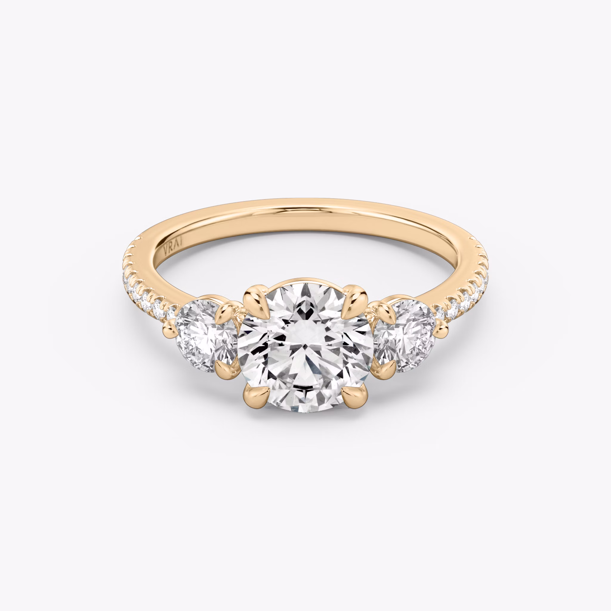 The Three Stone | Round Brilliant | 14k | Rose Gold | bandAccent: Pavé | caratWeight: other | sideStoneCarat: 0.25ct | sideStoneShape: Round Brilliant | diamondOrientation: vertical