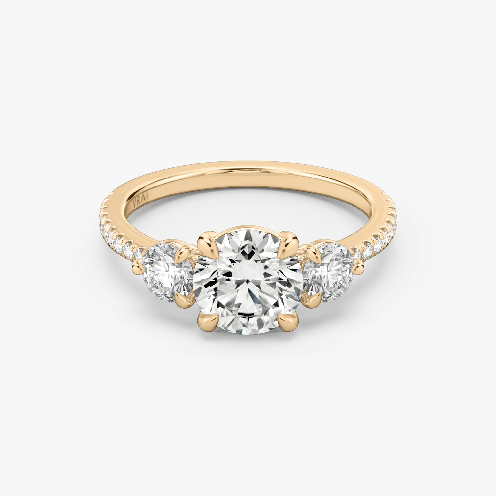 The Three Stone | Round Brilliant | 14k | Rose Gold | bandAccent: Pavé | caratWeight: other | sideStoneCarat: 0.25ct | sideStoneShape: Round Brilliant | diamondOrientation: vertical