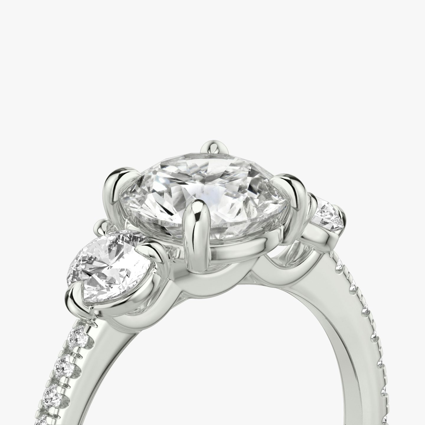 The Three Stone | Round Brilliant | 18k | White Gold | bandAccent: Pavé | caratWeight: other | sideStoneCarat: 0.25ct | sideStoneShape: Round Brilliant | diamondOrientation: vertical