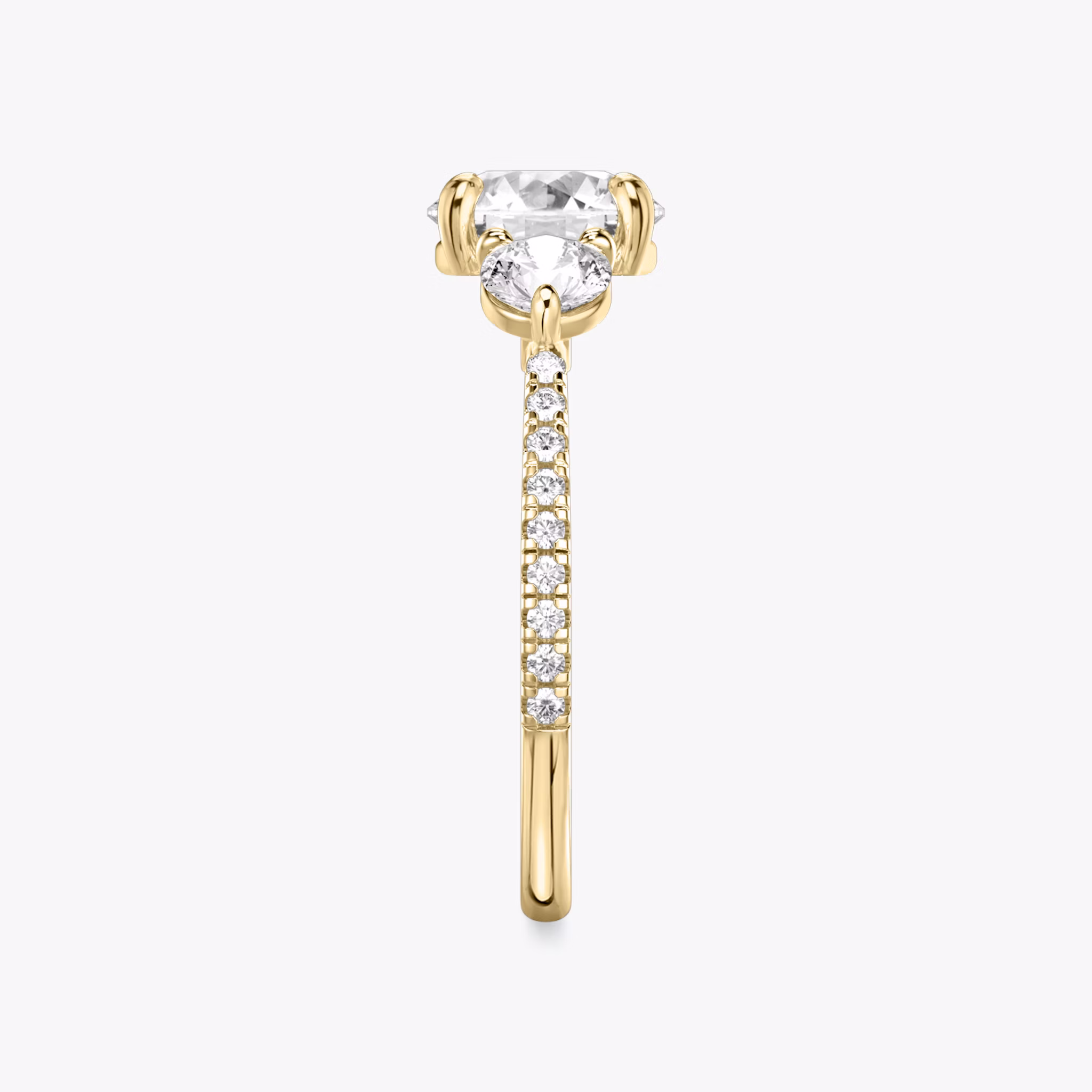 The Three Stone | Round Brilliant | 18k | Yellow Gold | bandAccent: Pavé | caratWeight: other | sideStoneCarat: 0.25ct | sideStoneShape: Round Brilliant | diamondOrientation: vertical