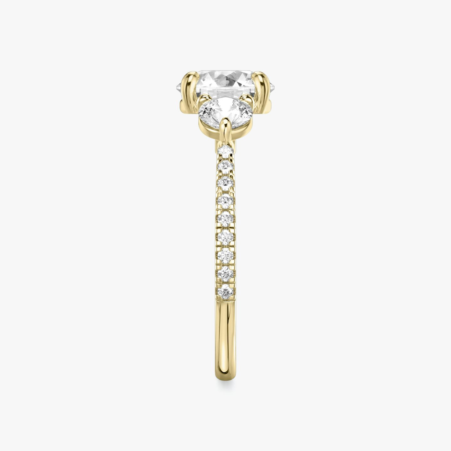 The Three Stone | Round Brilliant | 18k | Yellow Gold | bandAccent: Pavé | caratWeight: other | sideStoneCarat: 0.25ct | sideStoneShape: Round Brilliant | diamondOrientation: vertical